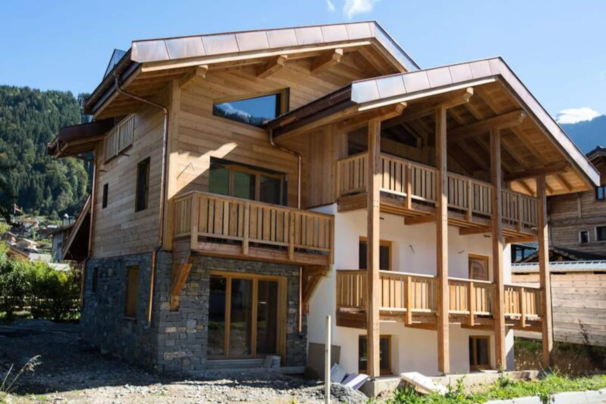 In the heart of Morzine, where alpine charm meets modern convenience, this exceptional property offers a luxurious retreat just moments from the village’s vibrant center. Imagine waking up to the crisp mountain air, stepping onto your private balcony, and soaking in the breathtaking views of the surrounding peaks. With the Super Morzine gondola only 200 meters away and the Pleney gondola accessible via a free shuttle train, your alpine adventures begin right at your doorstep. Whether you’re here for skiing, hiking, or simply relaxing, this chalet promises an unforgettable stay in one of the most picturesque locations in the French Alps.\n\nDesigned for comfort and style, the chalet boasts a spacious living and dining area complete with a cozy fireplace, a fully equipped kitchen, and a terrace perfect for enjoying morning coffee or evening gatherings. The mezzanine with a television provides a cozy nook for entertainment, while the sauna and shower offer a private spa-like experience after a day on the slopes. Each of the five bedrooms is thoughtfully designed with queen-size beds or flexible configurations, private balconies, and en-suite bathrooms featuring modern amenities. The family suite includes an additional bedroom with bunk beds, making it ideal for larger groups or families.\n\nMorzine’s charm extends beyond the chalet, with nearby restaurants, shops, and ski lifts creating a lively yet serene atmosphere. The village’s blend of traditional Savoyard architecture and modern facilities ensures there’s something for everyone. Whether you’re exploring the slopes, indulging in local cuisine, or wandering through the quaint streets, Morzine offers a perfect balance of adventure and relaxation.\n\nChoose this property for its unparalleled location, luxurious amenities, and the promise of creating memories that will last a lifetime. From the moment you arrive, you’ll feel the magic of the French Alps envelop you in warmth and wonder.
