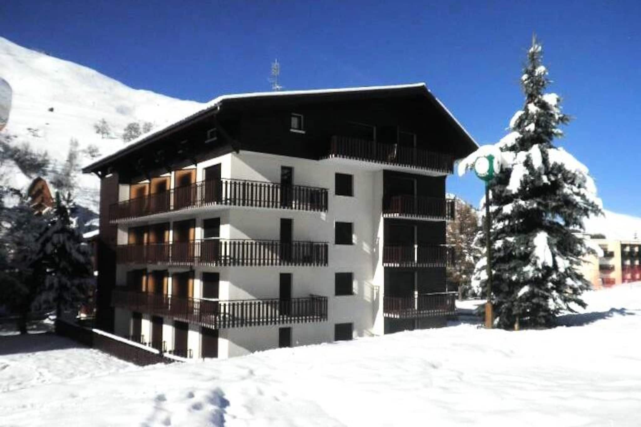 High above the charming alpine village of Les Deux Alpes, this top-floor apartment offers a serene retreat with direct ski-in/ski-out access. Imagine stepping out of your door and gliding straight onto the slopes, with the Champamé ski school meeting points just steps away. As the sun sets, enjoy the peaceful ambiance of this quiet residence, perfectly complemented by the convenience of shops just 200 meters away. The west-facing balcony provides a stunning vantage point to soak in the mountain views and alpine sunsets. \n\nInside, the apartment is designed for comfort and practicality. Three separate bedrooms cater to groups and families, featuring a queen-size bed with a private sink, a room with two single beds, and another with a single bed and pull-out bed. The living room invites relaxation with a cozy double sofa bed, flat-screen TV, and DVD player. The fully equipped kitchen boasts modern amenities, including a dishwasher, oven, microwave, Nespresso machine, and even a raclette grill for authentic alpine dining. A spacious bathroom with a walk-in shower and a separate toilet ensures convenience for all guests.\n\nThis residence is not only a winter haven but also a summer delight. In the warmer months, enjoy hiking, mountain biking, and exploring the breathtaking landscapes of the French Alps. With services like bed linen, towels, and end-of-stay cleaning included in winter, and optional in summer, your stay is tailored for ease and relaxation. Whether you're here for thrilling ski adventures or tranquil alpine escapes, this apartment offers an unforgettable mountain getaway.