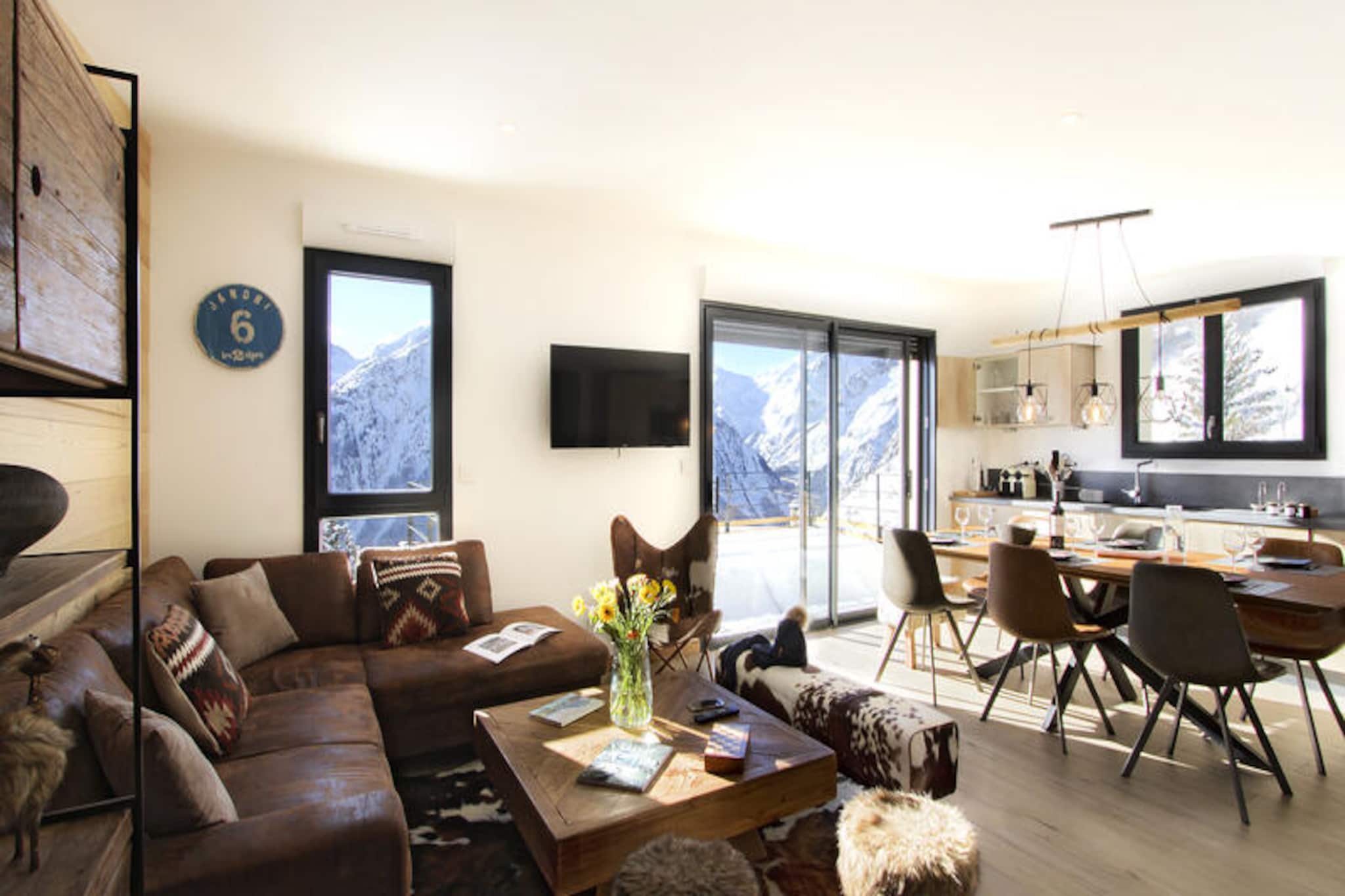 In a serene corner of the French Alps, this newly renovated residence offers a tranquil escape with breathtaking views of the Muzelle Glacier. Surrounded by pristine nature, this property is a haven for those seeking both adventure and relaxation. The quiet location ensures peace, while the nearby free shuttle, just 200 meters away, makes exploring the area effortless. With the ski slopes only 500 meters from your door, winter sports enthusiasts will find themselves perfectly positioned for alpine adventures. \n\nThis spacious 90m² apartment comfortably accommodates up to nine guests, making it ideal for families or groups of friends. It features two cozy bedrooms with double beds and a third bedroom with five single beds, ensuring ample space for everyone. Two modern shower rooms and two separate toilets add convenience, while the large 30m² living room invites you to unwind with its TV and dining area. The kitchenette is fully equipped with an oven, microwave, and dishwasher, perfect for preparing hearty meals after a day on the slopes. Step out onto the 12m² southeast-facing terrace and soak in the stunning mountain vistas. Additional amenities include Wi-Fi, a ski locker with boot dryers, and parking with an electric vehicle charging point. \n\nIn winter, enjoy the luxury of beds made upon arrival, fresh towels, welcome amenities, and end-of-stay cleaning, while in summer, cleaning services are available, with linens and towels provided upon request. Whether you're here to ski, hike, or simply relax, this residence offers the perfect blend of comfort and convenience. Create unforgettable memories in this alpine retreat, where the beauty of the Muzelle Glacier is your daily backdrop.