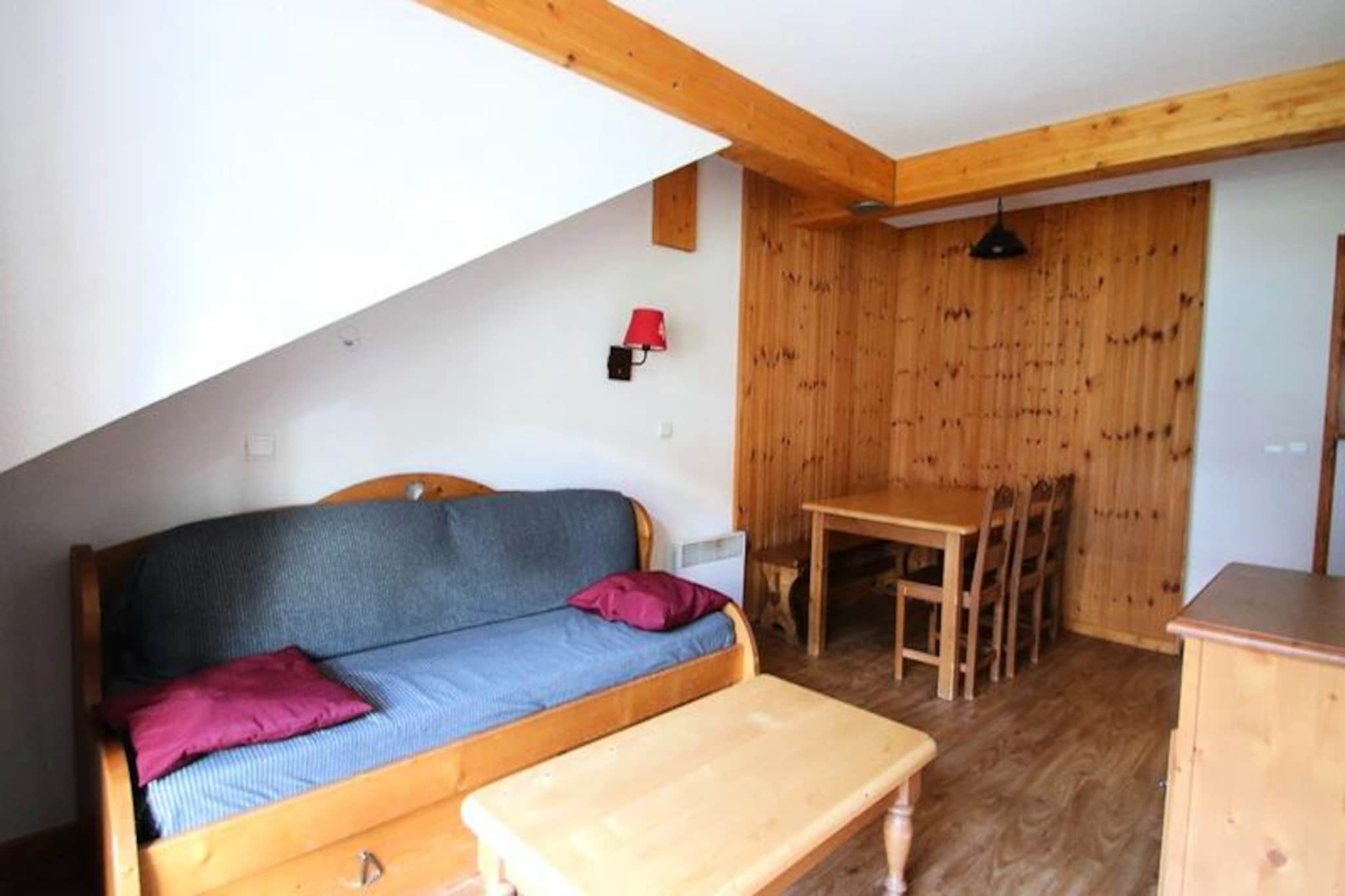 Perched in the serene heights of Puy Saint Vincent 1800, this charming apartment offers a cozy retreat for mountain enthusiasts looking to embrace the beauty of the French Alps. With breathtaking views and direct access to the ski slopes, every moment here is infused with alpine magic. Whether you’re visiting for winter sports or summer hikes, the residence provides an ideal base for your adventures. Imagine mornings spent sipping coffee on your private balcony, surrounded by crisp mountain air and the promise of a day filled with exploration. \n\nInside, the apartment is thoughtfully designed to accommodate up to six guests. The living room features a pull-out sofa bed, a flat-screen TV, and a dining area that invites you to share meals and stories after a day outdoors. The well-equipped kitchen includes modern amenities such as a microwave, ceramic hob, dishwasher, and coffee maker, ensuring you have everything you need for a comfortable stay. Sleeping arrangements include a cozy double bedroom and a cabin room with two single beds, making it perfect for families or small groups. A separate bathroom and toilet add convenience, while duvets and pillows are provided for restful nights.\n\nThe residence \