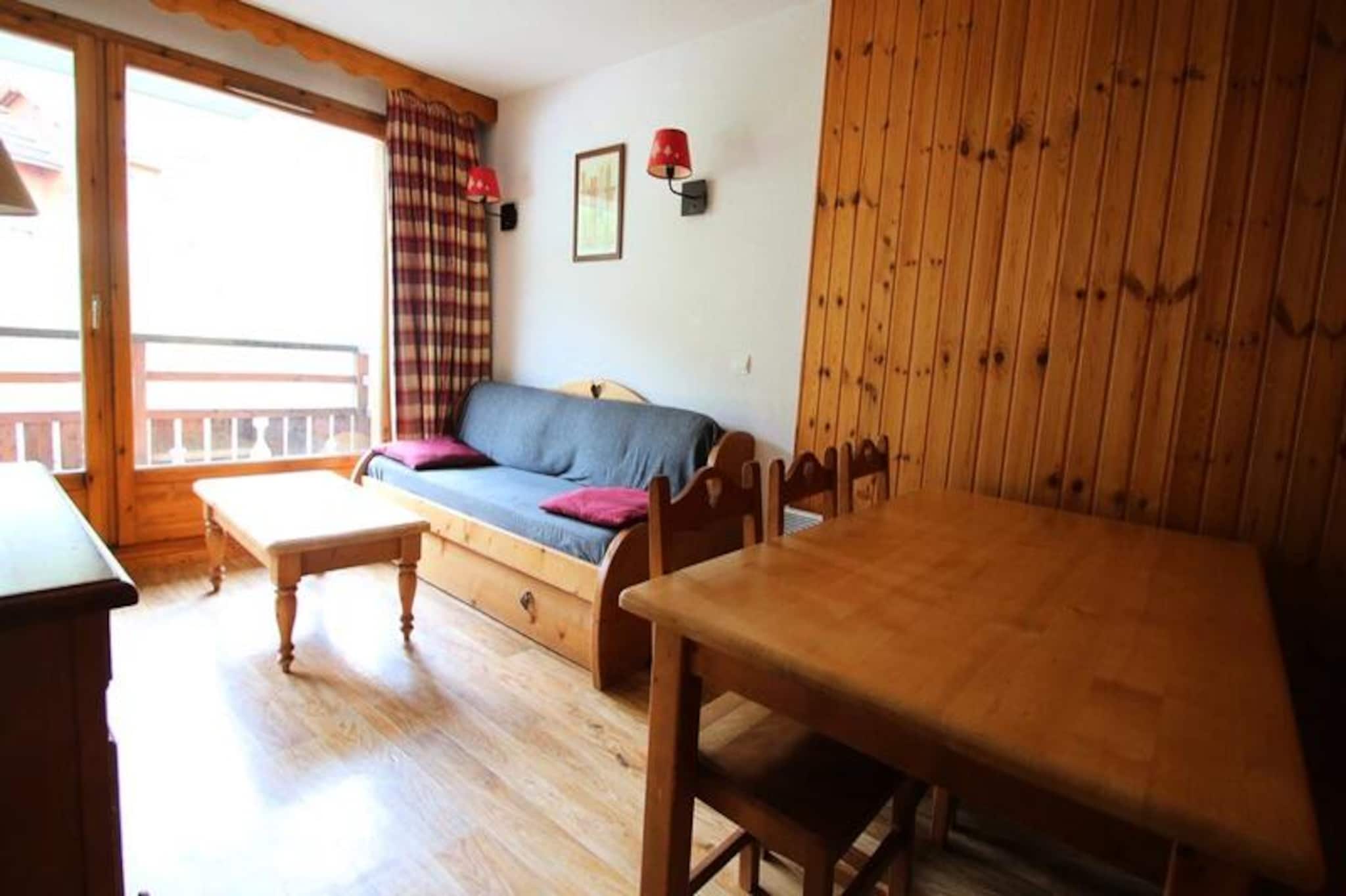 High above the serene valleys of Puy Saint Vincent, this charming alpine apartment offers a cozy retreat for families and small groups seeking a memorable mountain escape. With its warm ambiance and breathtaking views, this residence invites you to unwind and reconnect with nature in the heart of the French Alps. Whether you're here for the thrill of the slopes or the tranquility of the summer trails, this property promises an unforgettable stay. \n\nThe apartment is thoughtfully designed to accommodate 4-6 guests, featuring a fully equipped kitchen with modern appliances, a welcoming living room with a pull-out sofa bed, and a private balcony perfect for savoring your morning coffee while gazing at the majestic peaks. The sleeping arrangements include a comfortable double bedroom and a cozy cabin room with two single beds, ensuring restful nights after days filled with adventure. Additional amenities include a flat-screen TV, free WiFi, and a separate bathroom and WC for your convenience. \n\nSituated in the prestigious La Dame Blanche residence, guests enjoy direct access to the ski slopes, making it an ideal choice for winter sports enthusiasts. On-site facilities include a heated outdoor pool (open in summer), a sauna for ultimate relaxation, and a variety of dining options, including a restaurant, snack bar, and bakery. A ski rental shop and basic grocery store are conveniently located within the residence, ensuring all your needs are met. \n\nWhether you're exploring the pristine alpine trails in summer or carving through fresh powder in winter, this apartment offers the perfect base for your adventures. With its blend of comfort, convenience, and stunning surroundings, your alpine getaway awaits.