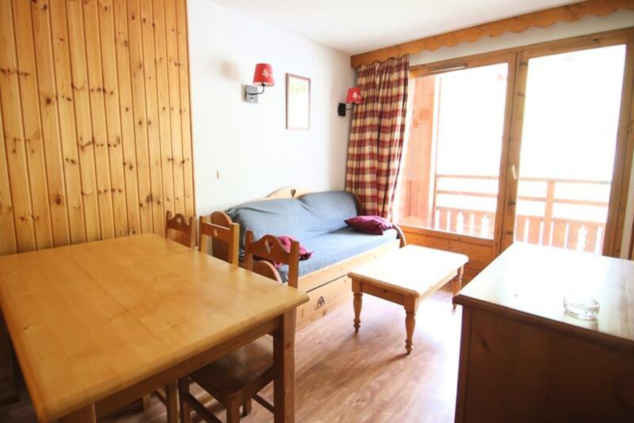 High above the serene valley of Puy Saint Vincent, this charming alpine apartment invites you to experience the perfect mountain retreat. With its cozy ambiance and breathtaking views, it’s an ideal haven for families or small groups seeking both adventure and relaxation in the heart of the French Alps. Imagine starting your day with a cup of coffee on the balcony, the crisp mountain air invigorating your senses as the sun rises over the snow-capped peaks. \n\nInside, the apartment is thoughtfully designed to accommodate 4-6 guests. The living room features a pull-out sofa bed, a dining area, and a flat-screen TV, creating a welcoming space to unwind after a day on the slopes. The well-equipped kitchen includes modern appliances such as a microwave, dishwasher, and coffee maker, ensuring all the comforts of home. The sleeping arrangements include a cozy double bedroom and a cabin room with two single beds, perfect for children or friends. A separate bathroom and WC add to the convenience, while the balcony offers a tranquil spot to soak in the stunning surroundings. \n\nSituated in the upper part of Puy Saint Vincent 1800, the La Dame Blanche residence provides direct ski-in/ski-out access, making it a dream for winter sports enthusiasts. On-site amenities include a heated outdoor pool (open in summer), a sauna, and essential shops like a bakery, restaurant, and ski rental service. Whether you’re hitting the slopes or exploring the picturesque trails in summer, everything you need is just steps away. \n\nWith its unbeatable location, modern comforts, and access to year-round alpine activities, this apartment is more than just a place to stay—it’s a gateway to unforgettable mountain adventures. Let the charm of Puy Saint Vincent captivate you and create memories that will last a lifetime.