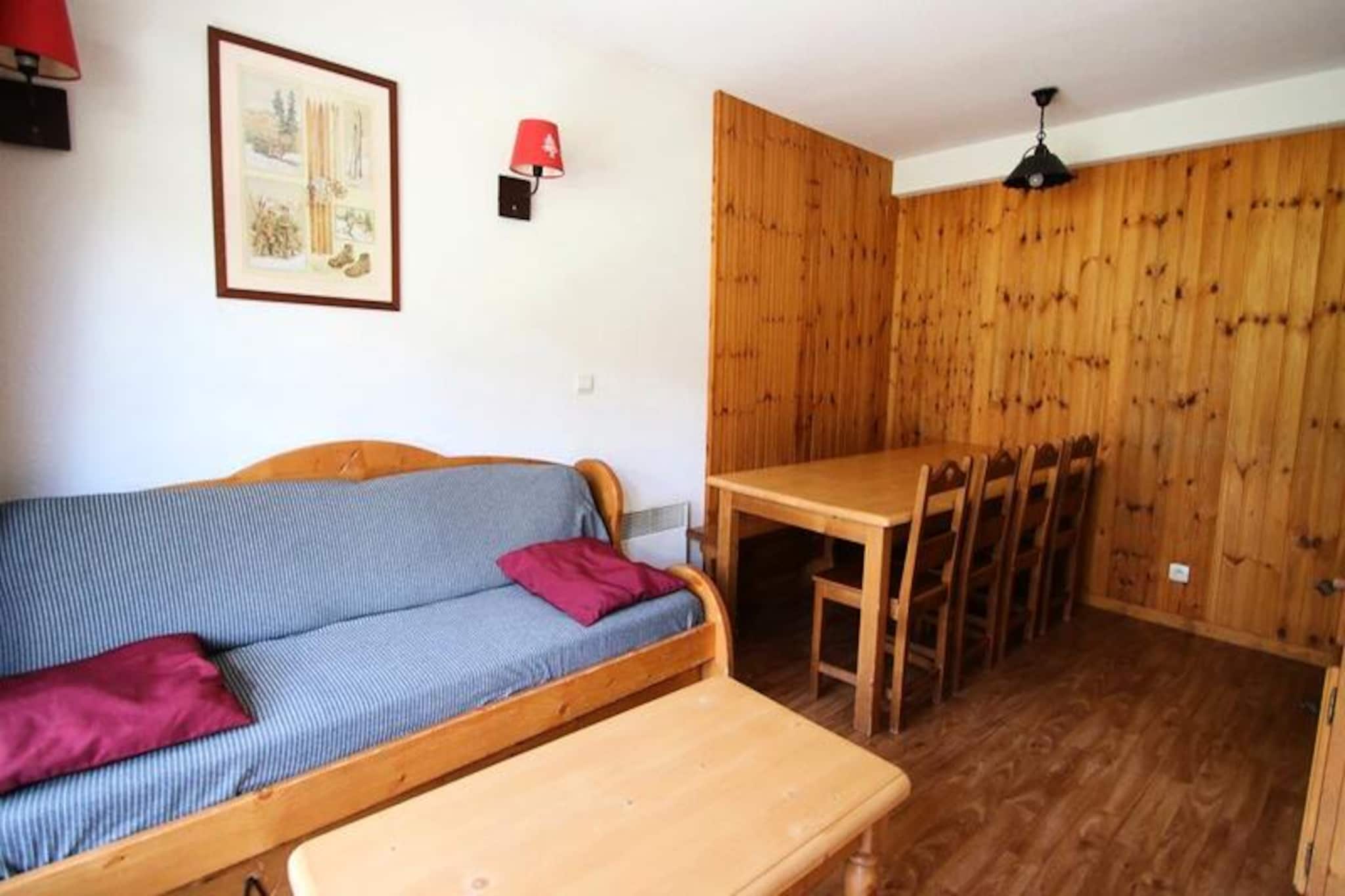 In the heart of the picturesque French Alps, this charming two-bedroom apartment offers a delightful retreat for families and groups of up to eight people. Located in the upper part of Puy Saint Vincent 1800, the residence La Dame Blanche combines modern comfort with direct access to the ski slopes, making it an ideal choice for winter sports enthusiasts and nature lovers alike. Imagine waking up to breathtaking mountain views, stepping onto your private balcony to enjoy the crisp alpine air, and heading straight into a day of adventure. Whether you’re here for skiing or simply to unwind, this property promises an unforgettable stay. \n\nInside, the apartment is thoughtfully designed to ensure maximum comfort and convenience. The fully equipped kitchen includes a microwave, dishwasher, ceramic hob, refrigerator, toaster, kettle, and coffee maker, perfect for preparing hearty meals after a day on the slopes. The living room features a pull-out sofa bed, a dining table, and a flat-screen TV, creating a cozy space for relaxation. Sleeping arrangements include a double bedroom, an alcove with bunk beds, and an upstairs bedroom with two single beds and an adjoining shower room. Additional amenities such as free WiFi and a separate bathroom and toilet add to the ease of your stay. \n\nThe residence itself boasts fantastic facilities, including a heated outdoor swimming pool (open in summer), a sauna available by reservation, and a coin-operated laundromat. At the foot of the residence, you’ll find a restaurant, snack bar, bakery, and essential grocery store, as well as a ski equipment rental shop for added convenience. For those arriving by car, covered parking is available for rent. \n\nWhether you’re seeking thrilling ski adventures or peaceful summer hikes, this apartment places you in the perfect location to explore the beauty of the French Alps. With its blend of comfort, convenience, and stunning surroundings, La Dame Blanche is your gateway to a truly memorable alpine escape.