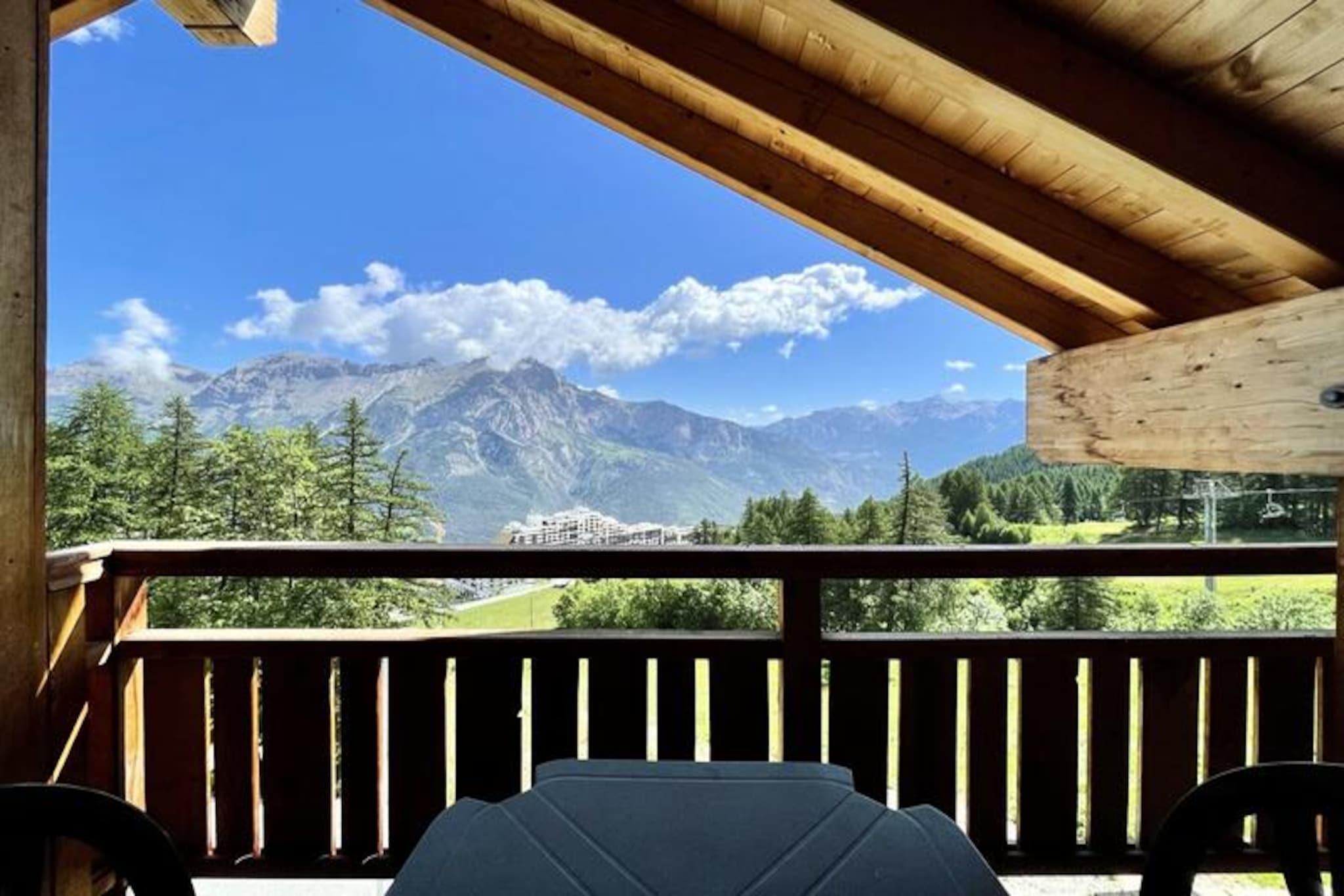 Perched high in the serene alpine village of Puy Saint Vincent 1800, this charming three-bedroom apartment offers a perfect retreat for families and groups seeking a memorable mountain holiday. With breathtaking views of the surrounding peaks and direct access to pristine ski slopes, every moment here is infused with the magic of the French Alps. Whether you're here to carve through fresh powder or explore scenic trails in summer, this residence is your gateway to adventure and relaxation. \n\nInside, the apartment is thoughtfully designed to combine comfort and practicality. The living room features a cozy pull-out sofa bed, a flat-screen TV, and a balcony where you can savor your morning coffee while soaking in the crisp mountain air. The fully equipped kitchen includes modern appliances such as a microwave, dishwasher, ceramic hob, and coffee maker, ensuring you have everything needed for home-cooked meals. Sleeping arrangements are ideal for up to eight guests, with two double bedrooms (one with an en-suite shower) and a twin room with ample storage. A heated towel rail in the bathroom and separate WC add to the convenience. \n\nThe residence itself boasts excellent amenities, including a heated outdoor pool (available in summer), a sauna for unwinding after a day on the slopes, and a coin-operated laundromat. At the foot of the residence, you'll find a restaurant, snack bar, bakery, and ski rental shop, making it easy to access everything you need. \n\nWhether you're drawn by the thrill of skiing, the tranquility of alpine summers, or the charm of local dining and culture, this apartment offers an unforgettable escape in the heart of the mountains. Let the beauty of Puy Saint Vincent 1800 inspire your next adventure.