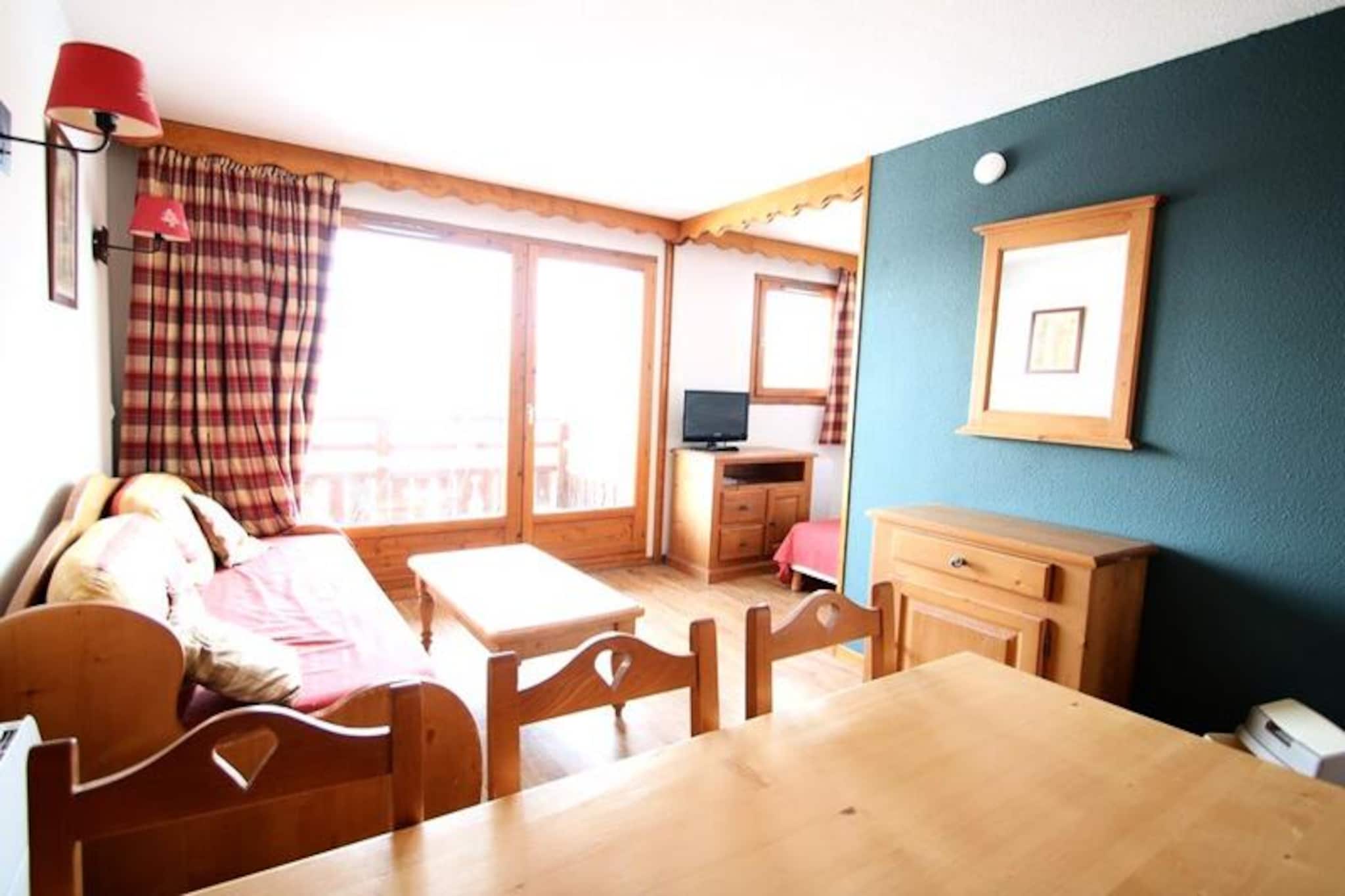 High above the serene valley of Puy Saint Vincent, this charming apartment invites you to experience the beauty of the French Alps in comfort and style. With breathtaking views and direct access to the ski slopes, every moment here feels like a celebration of alpine living. Whether you're sipping coffee on the balcony or preparing for a day of adventure, the crisp mountain air and tranquil surroundings set the perfect tone for your holiday escape. \n\nDesigned to accommodate up to six guests, the apartment boasts a thoughtfully furnished interior that blends practicality with cozy charm. The living room features a pull-out sofa bed, a flat-screen TV, and a dining area, while the fully equipped kitchen includes modern appliances such as a Nespresso machine, dishwasher, and ceramic hob. Two bedrooms offer restful retreats with new mattresses, duvets, and ample storage space. A separate bathroom and WC ensure convenience for families or groups. \n\nThe residence, La Dame Blanche, is a haven for relaxation and recreation. Guests can enjoy a heated outdoor pool during summer months, a sauna for unwinding after a day on the slopes, and convenient amenities like a ski rental shop, bakery, and snack bar right at the foot of the building. Free WiFi keeps you connected, while optional services such as linen and towel rentals, baby kits, and covered parking add extra comfort to your stay. \n\nWhether you're here for winter sports or summer hikes, this alpine retreat offers everything you need for an unforgettable holiday. Let the charm of Puy Saint Vincent and the welcoming ambiance of La Dame Blanche create lasting memories for you and your loved ones.