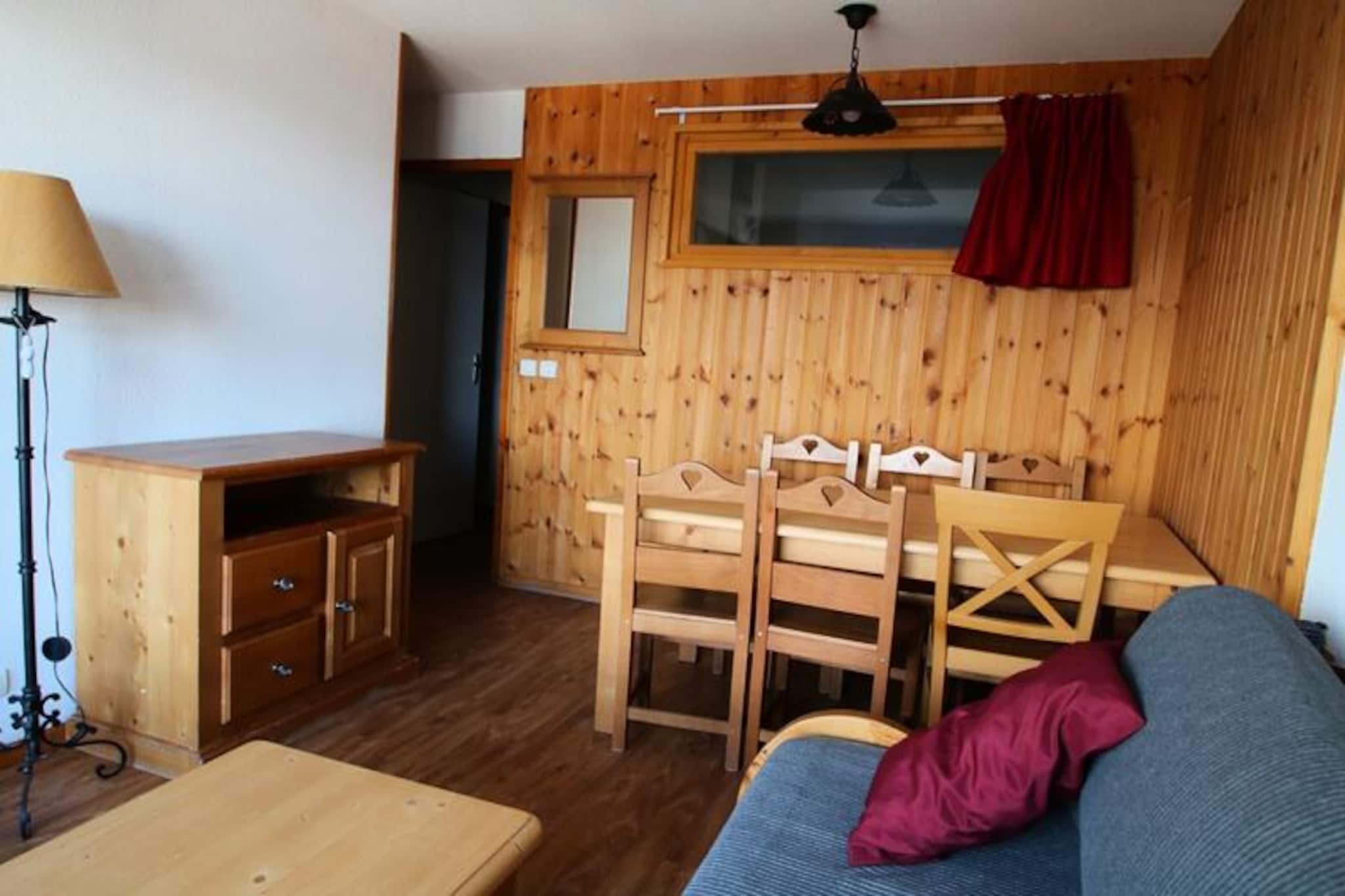 High above the serene valleys of the Hautes-Alpes, this charming apartment in the La Dame Blanche residence invites you to experience the perfect alpine getaway. With its cozy ambiance and breathtaking views, it’s an ideal retreat for families or small groups seeking both adventure and relaxation in the heart of Puy Saint Vincent 1800. The residence’s direct access to the ski slopes ensures that your mountain adventures begin right at your doorstep. \n\nInside, the apartment is thoughtfully designed to accommodate 4-6 guests. The living area features a pull-out sofa bed, a flat-screen TV, and a dining table, all leading to a private balcony where you can enjoy your morning coffee with stunning mountain vistas. The fully equipped kitchen includes modern appliances such as a microwave, dishwasher, and ceramic hob, making it easy to prepare hearty meals after a day on the slopes. The sleeping arrangements are equally comfortable, with a double bedroom and a cozy cabin room with two single beds, all outfitted with soft duvets and pillows. A separate bathroom and WC add to the convenience of your stay. \n\nThe La Dame Blanche residence offers a range of amenities to enhance your holiday. A heated outdoor pool is available during the summer months, while a sauna provides a relaxing escape after a day of skiing or hiking. On-site facilities include a restaurant, snack bar, bakery, and a ski rental shop, ensuring you have everything you need within easy reach. For added convenience, free WiFi and a coin-operated laundromat are also available. \n\nWhether you’re here to carve through pristine slopes in winter or explore the lush alpine trails in summer, this apartment offers an unbeatable combination of comfort, convenience, and natural beauty. Let the magic of the French Alps create unforgettable memories for you and your loved ones.