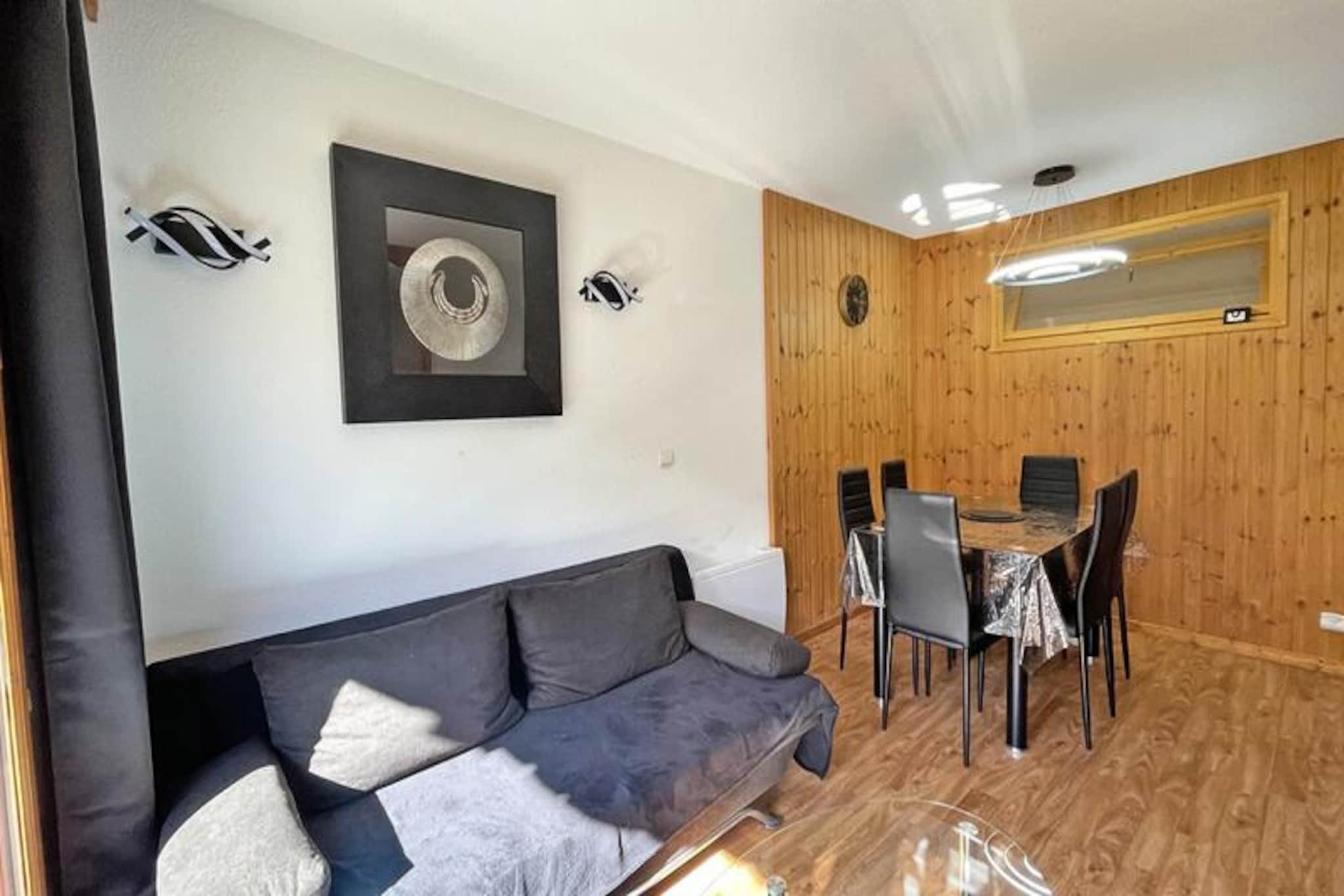 In the heart of the serene Hautes-Alpes, this charming apartment offers a delightful escape for those seeking tranquility paired with modern comforts. With its south-facing terrace, you can bask in the warmth of the alpine sun while enjoying panoramic views of the surrounding peaks. Whether you're here for a summer retreat or a winter getaway, the ambiance invites you to relax and reconnect with nature in a setting that feels both intimate and invigorating. \n\nDesigned to accommodate up to six guests, the apartment blends functionality with cozy elegance. The living room features a comfortable sofa bed, a dining area, and a flat-screen TV, creating a welcoming space to unwind after a day of exploration. The fully equipped kitchen includes a dishwasher, ceramic hob, microwave, and other essentials, making meal preparation a breeze. Sleeping arrangements include a double bedroom and a cabin room with twin beds, all dressed with soft duvets and pillows for restful nights. A separate bathroom and toilet ensure convenience for families or groups. \n\nGuests can indulge in the heated outdoor pool during the summer months or reserve the sauna for a rejuvenating session. Practical amenities like free WiFi, a coin-operated laundromat, and optional linen and towel rentals enhance the comfort of your stay. For those arriving by car, covered parking is available for rent. \n\nLocated in a region renowned for its natural beauty and outdoor activities, this residence is a gateway to alpine adventures. From hiking trails and cycling routes to nearby ski resorts, every season offers unique experiences. Whether you're seeking relaxation or adventure, this property promises an unforgettable stay in the French Alps.