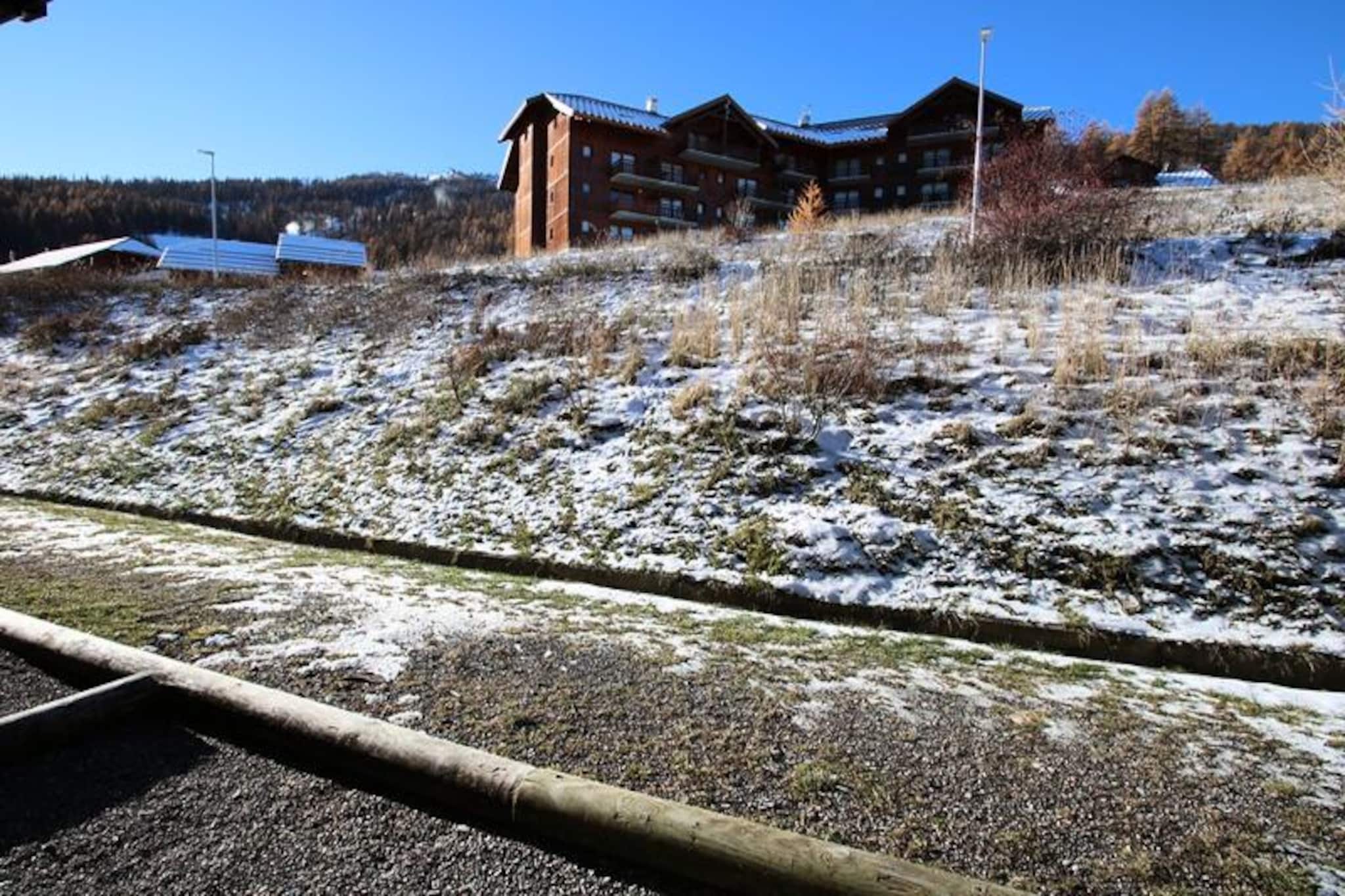 In the serene heights of Puy Saint Vincent 1800, this charming apartment invites you to experience the beauty of the Alps with modern comfort and convenience. Imagine waking up to the crisp mountain air and stepping out onto your spacious south-facing terrace, where sunlight bathes the surroundings and the majestic peaks provide a breathtaking backdrop. Whether you're here for winter skiing or summer hiking, this residence offers a tranquil retreat amidst nature's splendor. \n\nInside, the apartment is thoughtfully designed to accommodate up to six guests. The living room features a comfortable pull-out sofa bed, a dining area, and a flat-screen TV, creating a cozy space to unwind after a day of adventure. The fully equipped kitchen, complete with a microwave, dishwasher, and ceramic hob, makes meal preparation effortless. Two bedrooms provide restful sleeping arrangements, including a double bed and two single beds, all furnished with fresh duvets and pillows. A separate bathroom and WC add to the convenience, ensuring a smooth and relaxing stay for families or groups. \n\nThe La Dame Blanche residence enhances your holiday experience with direct access to ski slopes, a heated outdoor pool (open in summer), and a sauna for ultimate relaxation. On-site amenities include a restaurant, snack bar, bakery, and ski rental shop, offering everything you need within steps of your door. Free WiFi keeps you connected, while pet-friendly policies ensure every member of the family feels welcome. \n\nWhether you're exploring the pristine trails of the Alps, savoring local cuisine, or simply soaking in the panoramic views, this apartment is your gateway to unforgettable alpine adventures. Let the charm of Puy Saint Vincent and the comfort of La Dame Blanche create lasting memories for your next getaway.