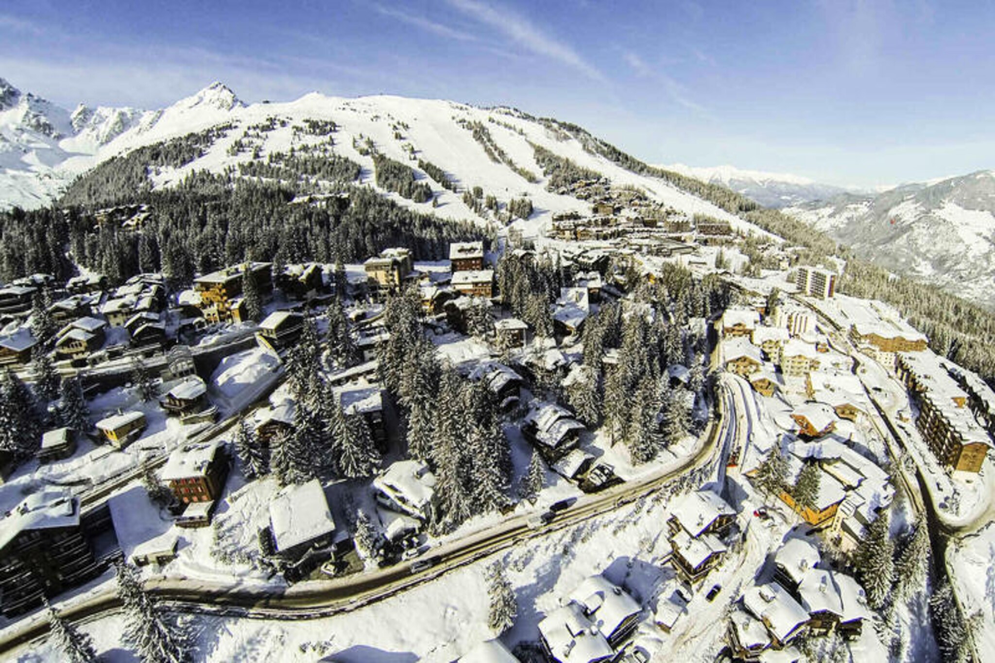 High above the shimmering slopes of Courchevel 1850, Ajacour chalet offers a serene retreat in the prestigious Chenus district. Here, amidst the quiet charm of the mountains, you’ll find a haven of comfort and elegance just steps from the Plantrey ski run. Imagine mornings spent gazing at snow-dusted peaks from the large terrace, followed by effortless access to the world-class ski area via the nearby Dou du Midi run and Plantrey chairlift. Whether you’re seeking adventure on the slopes or tranquil moments by the fire, this chalet is your gateway to an unforgettable alpine escape. \n\nAjacour’s thoughtful design spans four levels, blending rustic mountain charm with modern amenities. The heart of the chalet is its inviting living and dining area, complete with a crackling fireplace and a fully equipped open-plan kitchen. The master bedroom, located on the top floor, boasts an en-suite bathroom for ultimate privacy. Additional bedrooms, including a cozy bunk room perfect for families, ensure ample space for up to ten guests. After a day of skiing, unwind in the private sauna or enjoy the convenience of a ski room with boot dryers. Every detail has been curated for your comfort, from plush linens to personalized welcome touches. \n\nThe chalet’s prime location places you just 150 meters from the slopes, with easy access to Courchevel 1850’s vibrant center. Explore the village’s upscale boutiques, gourmet restaurants, and lively après-ski scene, or simply revel in the natural beauty of the surrounding peaks. Ajacour is more than a place to stay—it’s a sanctuary where cherished memories are made. Whether you’re here for winter sports or summer hikes, this mountain retreat promises a luxurious and rejuvenating experience.