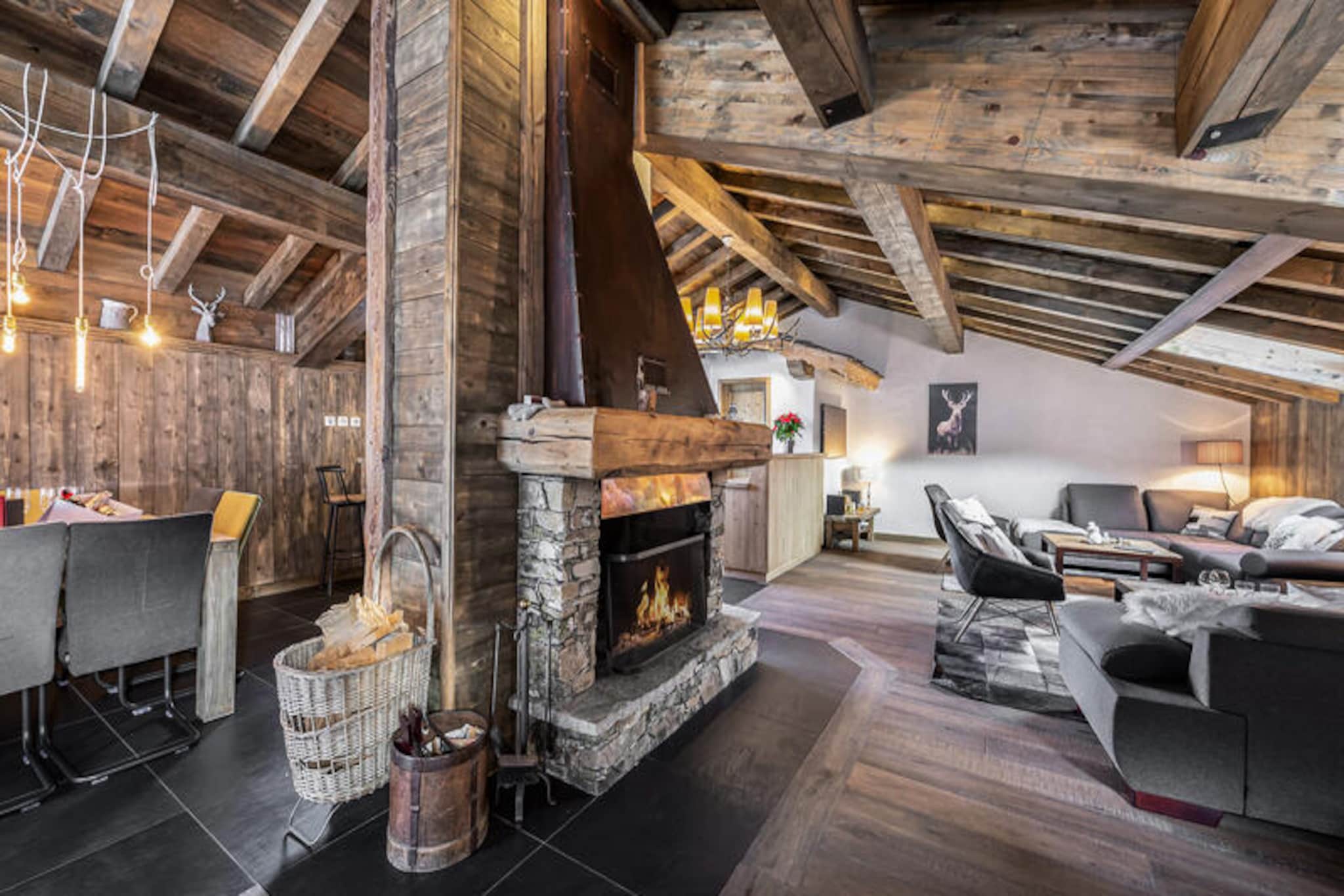 In the heart of the French Alps, Chalet l'Etagne offers an unparalleled retreat in the charming village of Courchevel Le Praz. This luxurious chalet, nestled in a private cul-de-sac opposite the shuttle stop, combines traditional alpine charm with modern elegance, making it an ideal choice for families and groups seeking a serene yet sophisticated mountain escape. With its prime location, you’ll find yourself surrounded by breathtaking landscapes and the vibrant atmosphere of one of the most prestigious ski destinations in the world. \n\nSpanning an impressive 370m², Chalet l'Etagne is designed to accommodate up to 10 adults and 2 children in absolute comfort. The spacious living and dining area, complete with a central fireplace, invites cozy evenings after a day on the slopes. The open-plan kitchen is fully equipped for culinary adventures, while the large terrace with triple exposure (south, west, and east) provides a stunning backdrop for morning coffee or evening relaxation. The chalet boasts a private spa area with a sauna, jacuzzi, and changing facilities, ensuring ultimate relaxation. The bedrooms, including a luxurious master suite and a family suite with a separate children’s room, are all en-suite and thoughtfully designed for privacy and comfort.\n\nStep outside, and you’re just moments away from the Courchevel Le Praz shuttle stop, offering seamless access to the world-renowned ski slopes of the Three Valleys. The charming village of Le Praz is a delight to explore, with its traditional chalets, gourmet restaurants, and picturesque lake. Whether you’re skiing in winter or hiking in summer, the surrounding area offers endless opportunities for adventure and relaxation.\n\nWith its exceptional amenities, prime location, and warm hospitality, Chalet l'Etagne promises an unforgettable alpine getaway. From the moment you arrive to a champagne welcome, you’ll feel at home in this exquisite mountain retreat, where every detail has been carefully curated for your comfort and enjoyment.