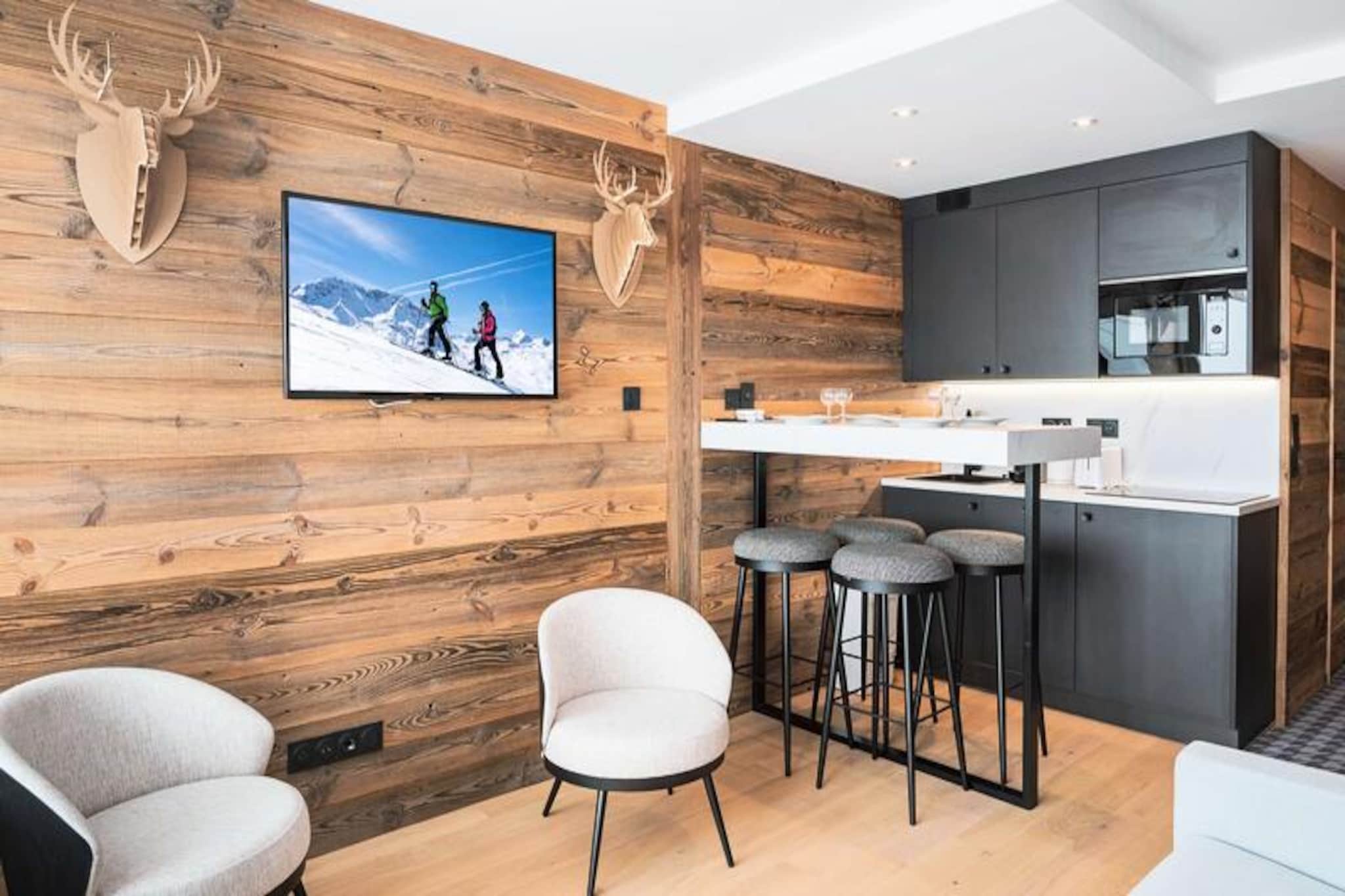 Awaken each morning to the breathtaking panorama of snow-capped peaks and pristine slopes from this beautifully renovated 25m² apartment in the heart of Val Thorens. With its contemporary mountain-style decor and a prime location in the Roc de Péclet I residence, this cozy retreat offers a perfect blend of charm and convenience for up to four guests. Whether you're here to carve through the world-renowned slopes or simply soak in the serene alpine atmosphere, this apartment promises an unforgettable stay.
Step inside to discover a thoughtfully designed living space featuring a fold-down bed, two comfortable armchairs, and a TV, all positioned to maximize the stunning south-facing views. The open-plan kitchen is fully equipped with modern appliances, including a ceramic hob, dishwasher, microwave, and Nespresso coffee machine, ensuring you have everything needed to prepare hearty meals after a day on the slopes. A separate sleeping alcove with bunk beds adds a touch of coziness, while the bathroom offers a refreshing shower, towel warmer, and all the essentials for your comfort.
Situated in the quiet and charming Slalom area, the Roc de Péclet I residence provides direct ski-in/ski-out access, making it a haven for winter sports enthusiasts. Just steps away, the Péclet shopping center offers a variety of shops, a pharmacy, and a twice-weekly market, ensuring all your needs are met within moments of your doorstep.
Whether you're drawn to the exhilarating slopes, the tranquil mountain vistas, or the vibrant local culture, this apartment is your gateway to the ultimate Val Thorens experience. Book your stay and create memories that will last a lifetime.