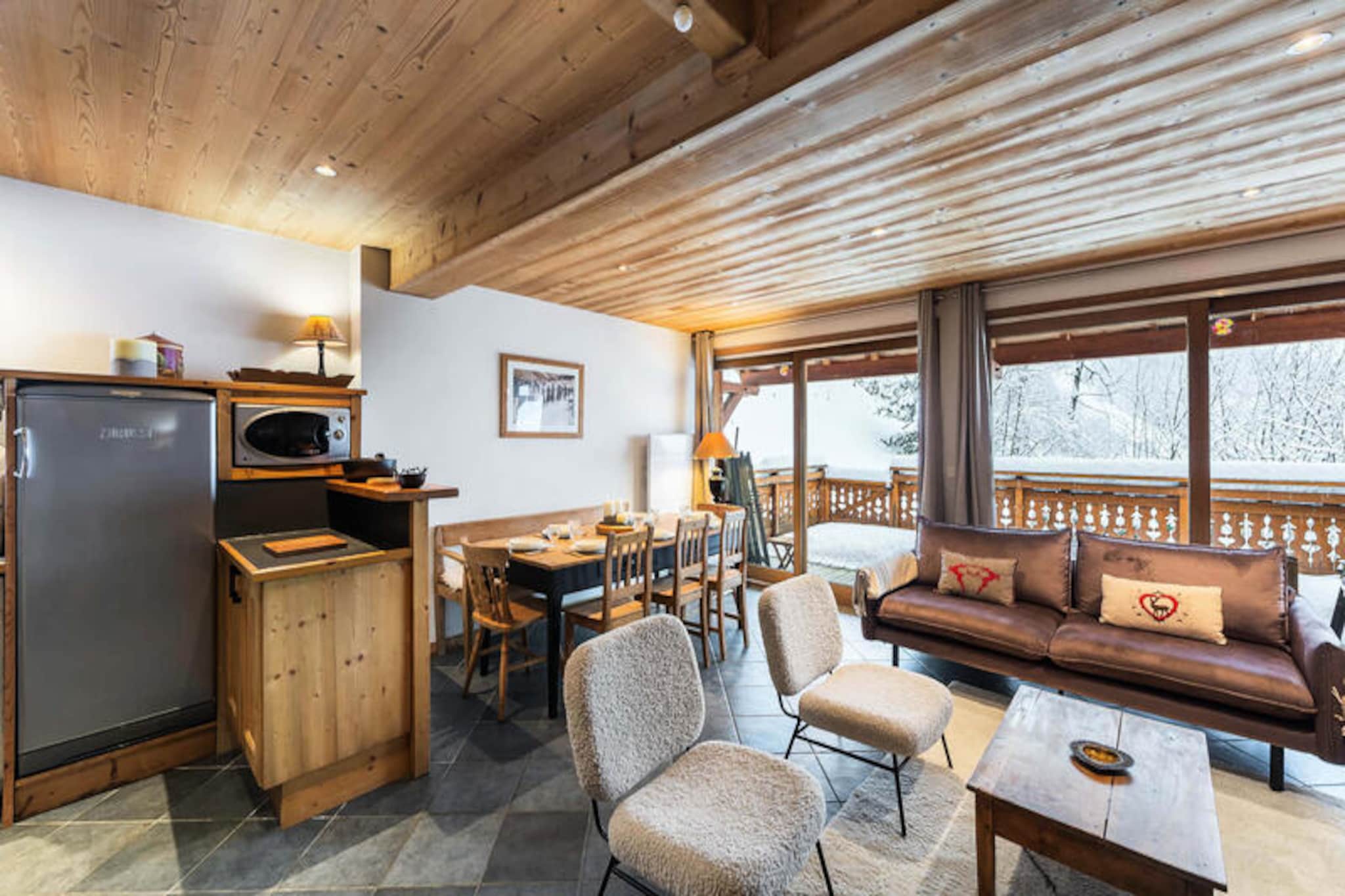 In the picturesque heart of Méribel Village, this charming duplex apartment offers a perfect retreat for those seeking a blend of alpine tranquility and easy access to world-class skiing. With the Golf chairlift just 360 meters away, you’ll find yourself effortlessly connected to the renowned 3 Valleys ski area, ensuring endless adventures on the slopes. The south-facing terrace invites you to soak in the sun while enjoying breathtaking views of the surrounding peaks, creating a serene backdrop for your mountain escape. 
 
 Spanning approximately 84m², this beautifully designed apartment comfortably accommodates up to six guests across three cozy bedrooms. The ground floor features an open-plan kitchen equipped with modern appliances, a welcoming living and dining area complete with a fireplace and a large sofa, and a spacious terrace perfect for après-ski relaxation. Upstairs, the bedrooms offer flexible sleeping arrangements, including a double bed and two single beds, along with a second terrace to enjoy the alpine air. Additional amenities such as a private garage, ski locker with boot dryer, and WiFi ensure a seamless and comfortable stay.
 
 Méribel Village itself is a delightful hub of convenience and charm, with restaurants, a bakery, a mini-market, and a sports shop just 400 meters away. A free shuttle service runs from early morning until late evening, making it easy to explore the wider resort. During school holidays, group ski lessons are held at the Altiport, while the Rond Point des Pistes hosts lessons throughout the season, catering to skiers of all levels.
 
 Whether you’re drawn by the allure of pristine slopes, the cozy ambiance of a crackling fire, or the vibrant village atmosphere, this apartment is the ideal base for creating unforgettable memories in the French Alps.