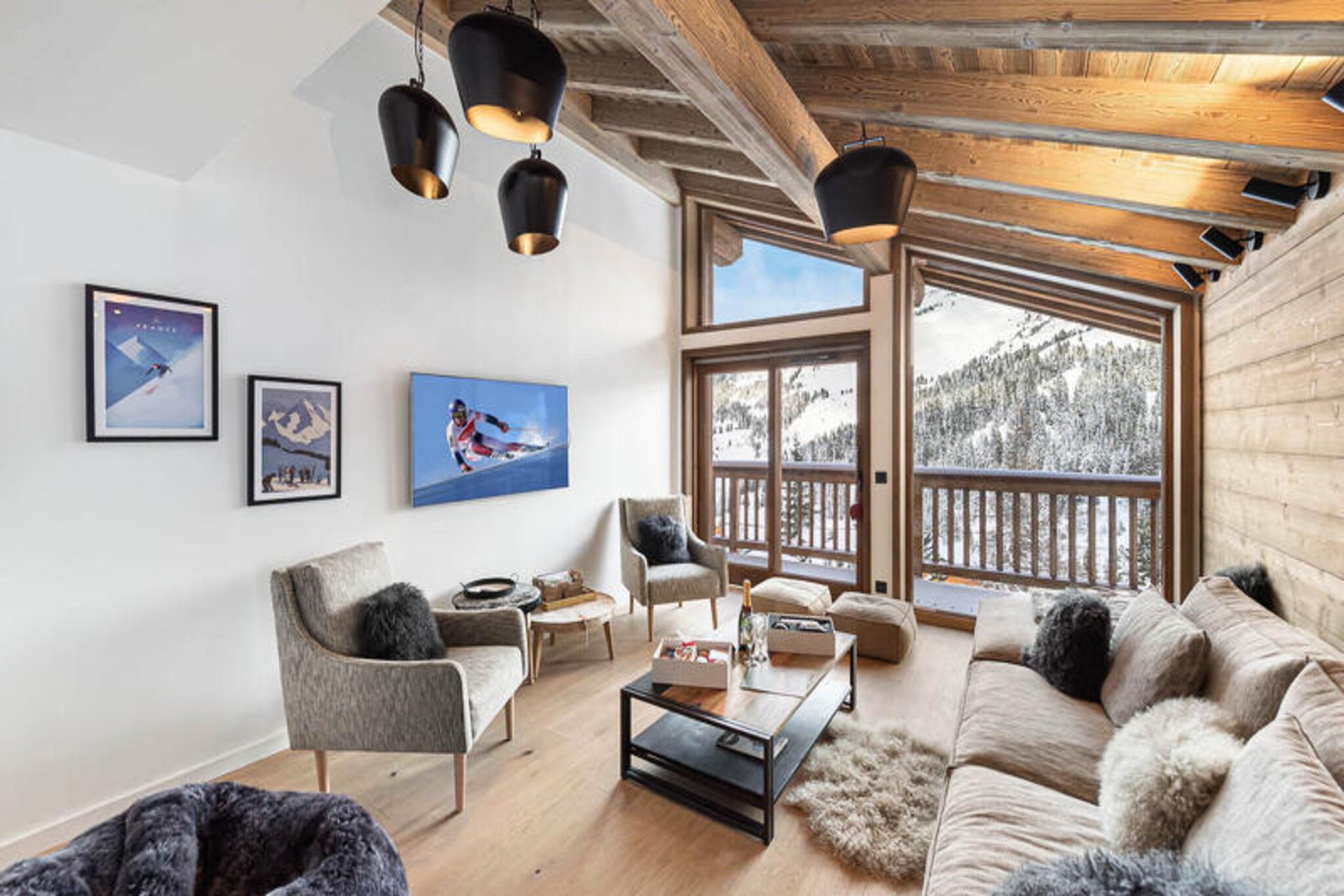 High above the picturesque Tarentaise Valley, Chalet Marmotte in Méribel-Mottaret offers an unforgettable alpine retreat. This semi-detached chalet, nestled at 1750 meters, combines the charm of traditional mountain living with modern comforts. With panoramic views from its east-facing balconies, the chalet is perfectly positioned near the slopes and just a short walk from the vibrant center of Mottaret, where ski shops, restaurants, and après-ski bars await. Whether you're here for the thrill of skiing or the serenity of nature, this chalet places you at the heart of it all. 
 
 Spanning four levels and approximately 150m², Chalet Marmotte is designed to accommodate up to 8 adults and 2 children. The chalet boasts four spacious bedrooms, including a luxurious master suite with a whirlpool bath, and a cozy cabin bedroom with a sofa bed. The open-plan living and dining area, complete with a wood-burning stove, invites you to unwind after a day on the slopes. The fully equipped kitchen features modern appliances, including a Nespresso machine and a fondue set, perfect for creating memorable meals. Additional amenities include a ski locker with a boot dryer, a laundry room, and private parking for up to three vehicles.
 
 Beyond the chalet, Méribel-Mottaret offers unparalleled access to the Three Valleys ski domain, the largest in the world. The nearby \