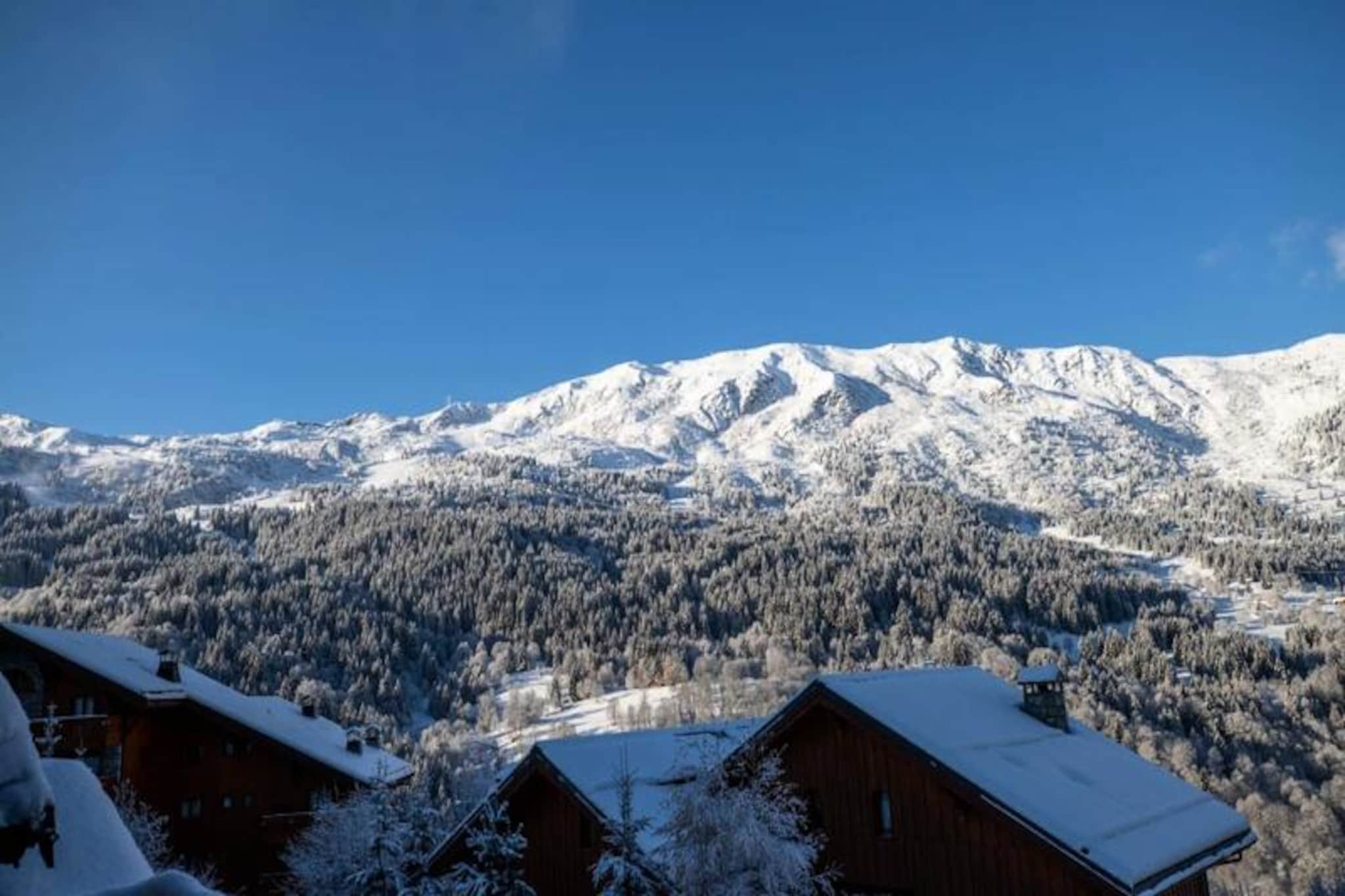 High above the picturesque Méribel valley, Chalet Clearmount offers a luxurious alpine retreat where comfort meets breathtaking mountain vistas. Imagine waking up to the serene beauty of snow-capped peaks, spending your days carving through the world-renowned slopes of the 3 Valleys, and returning to the warmth of a crackling fireplace in your private chalet. This recently renovated haven is designed to create unforgettable moments for families and groups of up to 12 guests. 
 
 The chalet boasts six beautifully appointed bedrooms, each with its own en-suite bathroom, ensuring privacy and relaxation for all. The spacious living area, with its floor-to-ceiling bay windows and a cozy fireplace, invites you to unwind after an exhilarating day on the slopes. The fully equipped American-style kitchen and west-facing terrace provide the perfect setting for shared meals and sunset views over the majestic mountains. Additional amenities include a spa area with a sauna and jacuzzi, a children’s video room, a ski room with boot dryers, and covered parking. 
 
 Located just minutes from Méribel Centre, Chalet Clearmount offers easy access to vibrant après-ski spots, gourmet restaurants, and charming shops. The free shuttle service, stopping just 50 meters from the chalet, ensures quick connections to the Chaudanne plateau and other key ski lift points. Whether you’re exploring the slopes of Courchevel, Les Menuires, or enjoying the Olympic Park’s ice rink and swimming pool, this chalet places you in the heart of it all. 
 
 With personalized services like ski pass delivery, equipment rental discounts, and private chef options, your stay at Chalet Clearmount promises to be as seamless as it is memorable. Experience the magic of Méribel in this exceptional alpine retreat.