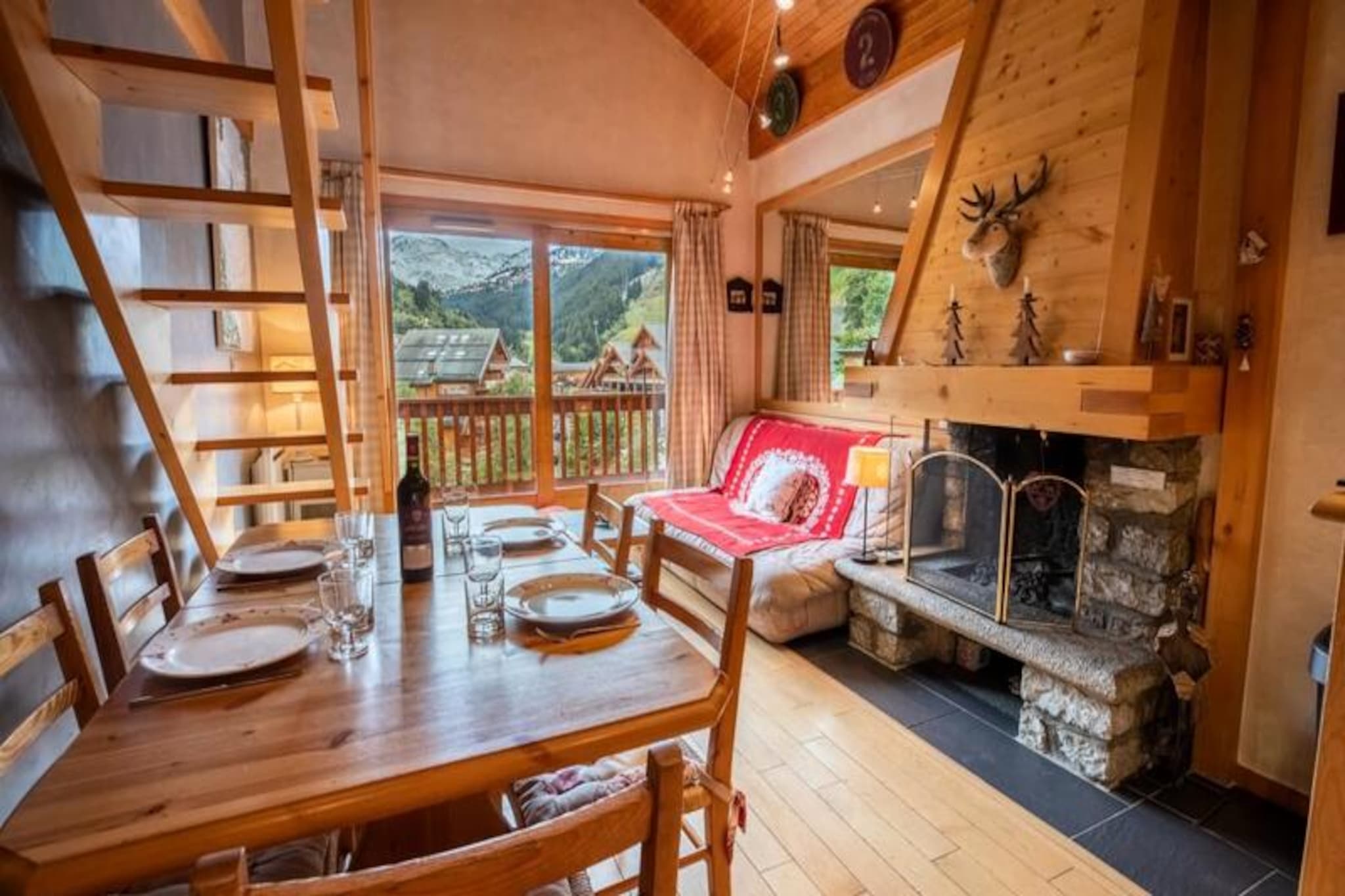 In the charming heart of Méribel Centre, this delightful duplex apartment offers a warm and inviting retreat for your alpine getaway. Just 250 meters from the main Chaudanne lift, you’ll enjoy seamless access to the world-renowned 3 Valleys ski area. Picture yourself strolling through the lively resort center, surrounded by cozy cafés, gourmet restaurants, and boutique shops, before retreating to your private haven. The Brimbelles residence combines the perfect blend of convenience and tranquility, making it an ideal choice for families or friends seeking a memorable mountain escape. 
 
 The apartment’s bright and airy living space is designed for comfort and relaxation. The open-plan kitchen, dining, and living area features a large bay window that opens onto a balcony, flooding the space with natural light and offering stunning views of the surrounding alpine scenery. The main level includes a bedroom with a double bed, a bathroom with a bathtub, and a separate toilet. Upstairs, you’ll find a cozy TV nook with a sofa bed, a second bedroom with two single beds, and an additional toilet. Modern amenities such as a fully equipped kitchen, dishwasher, washing machine, Wi-Fi, and a raclette grill ensure a convenient and enjoyable stay. A private parking space is also included for your convenience. 
 
 Méribel Centre is the vibrant hub of the resort, offering a wide array of activities and facilities. From the Olympic Park with its swimming pool, ice rink, and bowling alley to the free shuttle service connecting you to nearby slopes, everything you need is at your fingertips. The Chaudanne plateau, just a short walk away, serves as the main departure point for ski lifts, providing direct access to Courchevel and Les Menuires. Whether you’re exploring the slopes, indulging in local cuisine, or simply soaking in the alpine atmosphere, this duplex apartment is your gateway to an unforgettable holiday in the French Alps. 
 
 With additional services like ski pass delivery, equipment rental discounts, and in-home massages, your stay is tailored to perfection. Let the magic of Méribel and the comfort of this charming property create memories to last a lifetime.