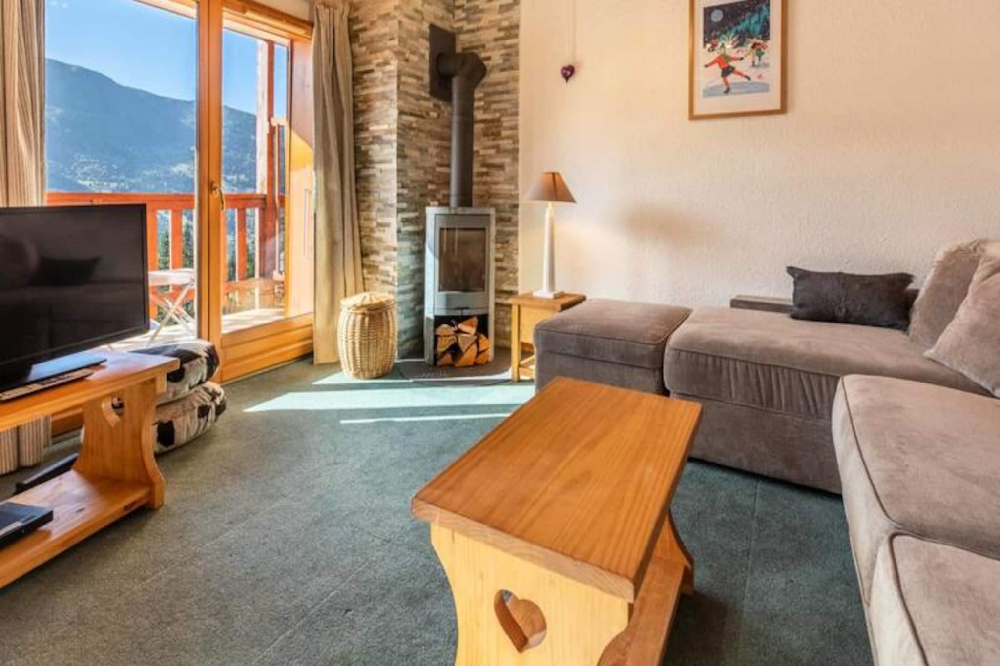 High above the charming alpine village of Méribel, this cozy duplex apartment offers a warm and inviting retreat for your next mountain getaway. With breathtaking views from its southwest-facing balcony and just 50 meters from the slopes, this property is a haven for ski enthusiasts and nature lovers alike. Whether you're here to carve through fresh powder or relax by the fire, this residence promises an unforgettable escape in the heart of the 3 Valleys. 
 
 Spread across two levels, the apartment comfortably accommodates up to six guests. The ground floor features a bright and spacious living area with plush sofas, a wood-burning stove, and a dining table perfect for shared meals. The well-equipped kitchen includes modern appliances such as an oven, refrigerator, coffee maker, and dishwasher, ensuring you have everything you need. The sleeping arrangements are thoughtfully designed: two single beds in the first bedroom, a bunk bed in the second, and a double bed in the third. Upstairs, you'll find an additional bedroom with two single beds and a second bathroom with a bathtub. For added convenience, the residence includes an elevator and a ski locker. 
 
 Situated between Morel and Rond Point des Pistes, the Le Plateau area is ideally located for easy access to the slopes, ski shops, and local dining options like Le Cèpe and Le Cromagnon. A free shuttle service stops nearby, making it simple to explore the valley and enjoy all that Méribel has to offer. Additional services such as ski pass delivery, equipment rental discounts, and in-home massages are available to enhance your stay. 
 
 Whether you're here for the thrill of skiing or the serenity of the mountains, this duplex apartment offers the perfect blend of comfort, convenience, and alpine charm. Let the CVR team take care of the details while you focus on creating unforgettable memories in the French Alps.