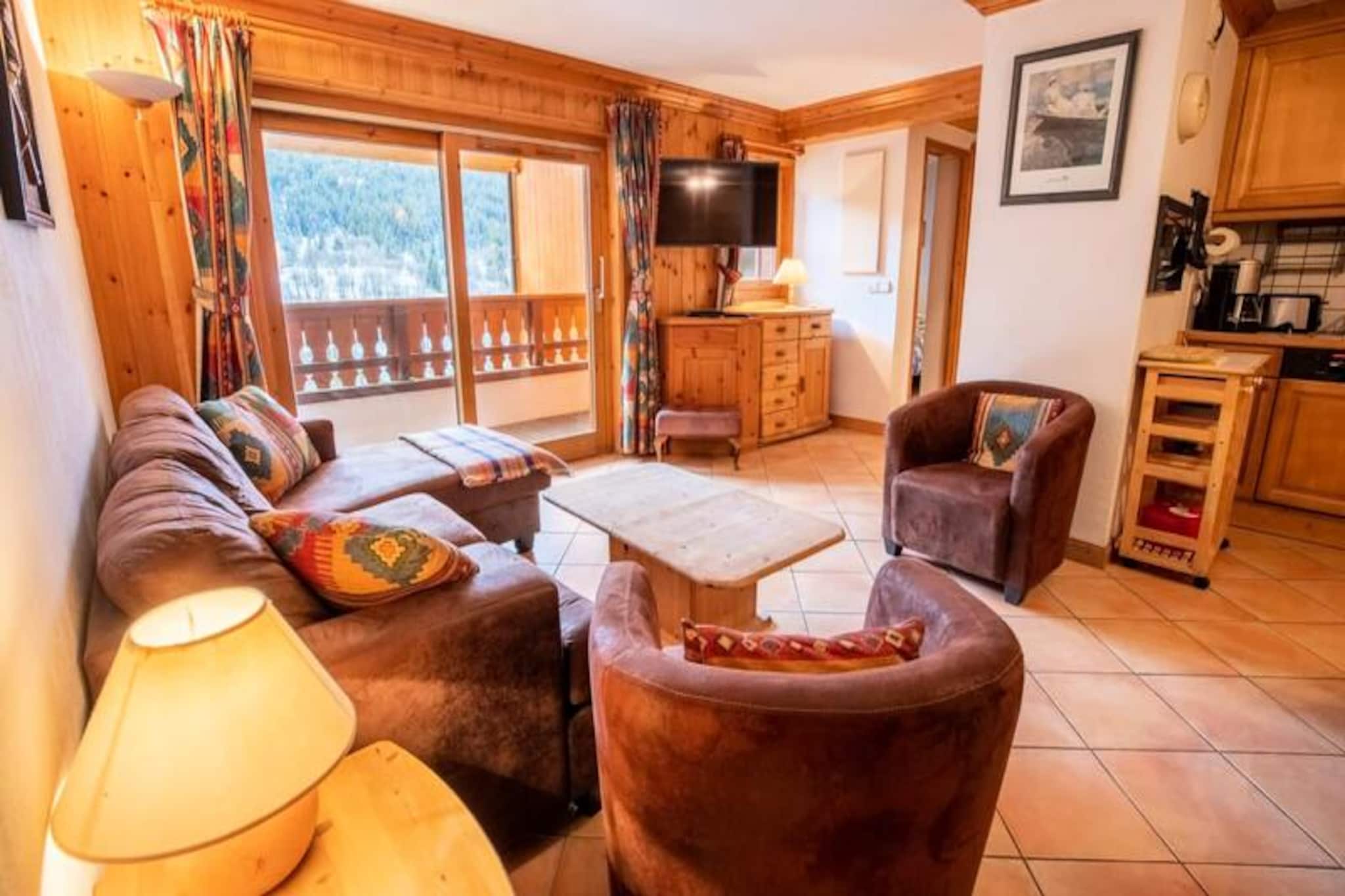 In the heart of the enchanting Méribel resort, this charming apartment in the Krystor residence offers a perfect alpine retreat just a 5-minute stroll from Méribel Centre. Imagine waking up to breathtaking mountain views from the large terrace, with the majestic Tougnette peaks greeting you each morning. Whether you're planning a family ski holiday or a getaway with friends, this cozy yet spacious apartment is designed to make your stay unforgettable. 
 
 Inside, you'll find a warm and inviting living space featuring a lounge area and a dining area that seamlessly connects to a fully equipped kitchen. The apartment comfortably accommodates up to six guests with three thoughtfully arranged bedrooms: two with double beds, one of which includes an en-suite bathroom with a bathtub and separate toilet, and a third bedroom with bunk beds. A second bathroom with a shower ensures convenience for all. Modern amenities such as a TV and a filter coffee maker add to the comfort of your stay. 
 
 Step outside, and you're just moments away from the vibrant Méribel Centre, home to a variety of bars, restaurants, and shops, including bakeries, supermarkets, and pharmacies. For ski enthusiasts, quick access to the slopes is available via the escalator at the Tourist Office or the Chaudanne plateau, the main hub for ski lifts connecting you to Courchevel and Les Menuires. The nearby Olympic Park offers year-round activities such as swimming, ice skating, and bowling, while free shuttles just 30 meters from the apartment make exploring the area effortless. 
 
 With additional services like ski pass delivery, equipment rental discounts, private chef options, and even in-home massages, every detail of your stay is taken care of. This Méribel gem is your gateway to the world-renowned 3 Valleys, where adventure and relaxation come together in perfect harmony.