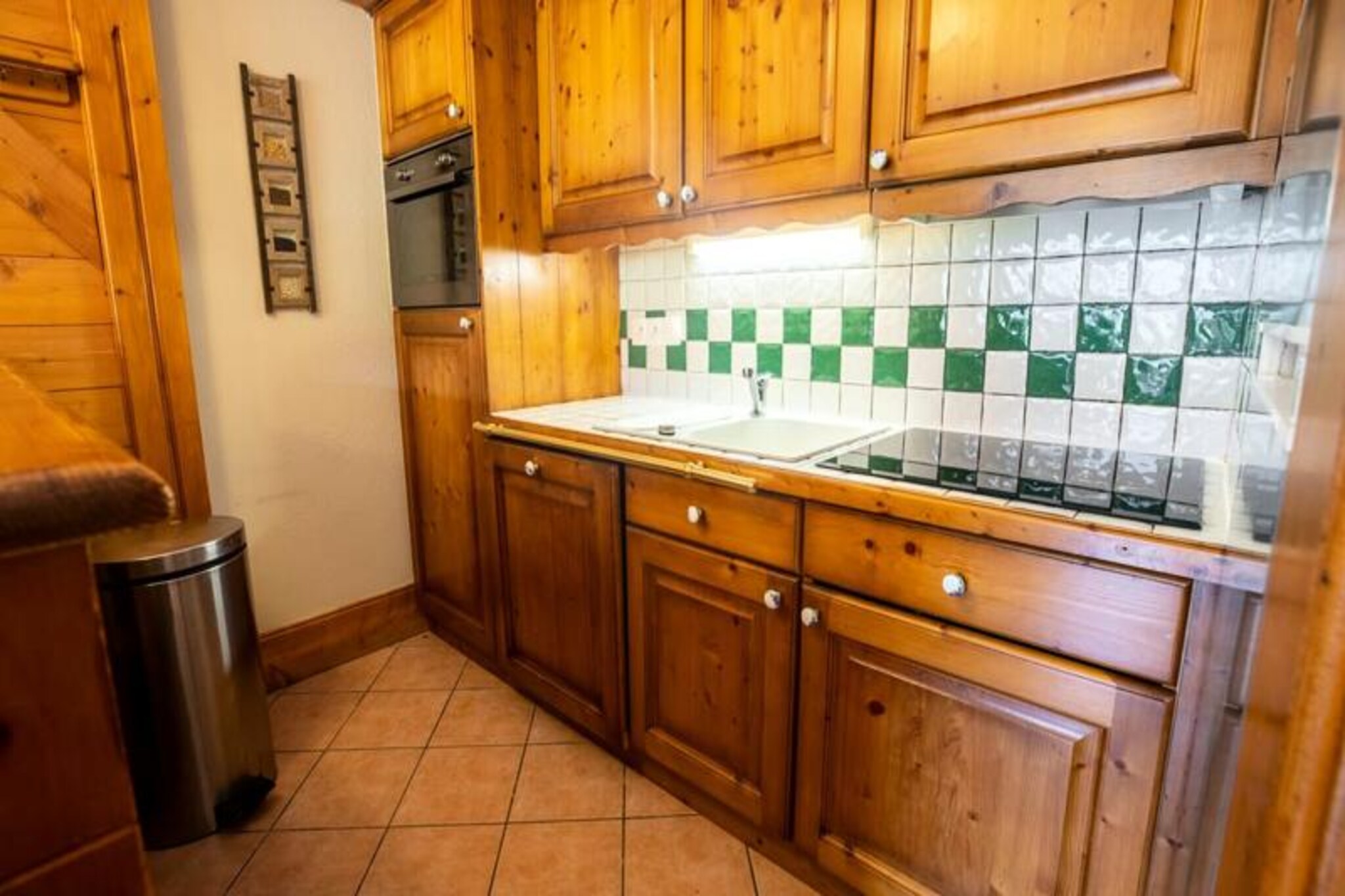 In the heart of Méribel Village, where alpine charm meets modern comfort, this ski-in/ski-out apartment offers an unforgettable mountain retreat. Imagine stepping out onto your terrace, strapping on your skis, and gliding directly onto the Lapin slope for a day of adventure in the world-renowned 3 Valleys ski area. Surrounded by the serene beauty of the French Alps, this property is perfect for families or friends seeking both convenience and tranquility. 
 
 The apartment comfortably accommodates up to six guests across three thoughtfully designed bedrooms. The master bedroom features a luxurious king-size bed and a private en-suite bathroom with a shower. A second bedroom also boasts a king-size bed, while the third bedroom offers cozy bunk beds perfect for children or additional guests. A second bathroom with a bathtub and a separate toilet in the entrance hall ensure everyone’s comfort. The open-plan living area invites relaxation with its spacious lounge, dining area, and fully equipped kitchen, complete with a dishwasher, Nespresso machine, and filter coffee maker. High-speed Wi-Fi and a flat-screen TV add to the convenience, while covered parking ensures a hassle-free stay. 
 
 Méribel Village is a picturesque haven with everything you need just a short stroll away. A charming Spar supermarket, a bakery, and the cozy Lodge du Village restaurant provide local delights, while a ski shop and the Golf chairlift offer seamless access to the slopes. The free shuttle service connects you to the wider Méribel area, making it easy to explore the valley’s vibrant après-ski scene and additional amenities. 
 
 Whether you’re here to carve through pristine snow, enjoy après-ski by a roaring fire, or simply soak in the breathtaking alpine views, this apartment is your gateway to an unforgettable mountain escape. Let the magic of Méribel Village captivate you as you create cherished memories in the heart of the Alps.