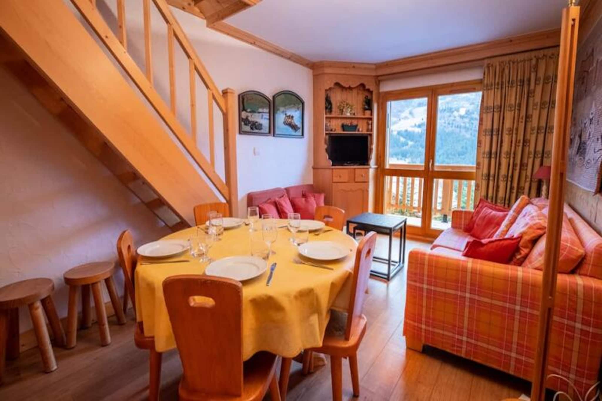 In the heart of the breathtaking Méribel Centre, this charming mezzanine apartment offers the perfect alpine retreat for families and friends seeking a memorable ski holiday. Surrounded by the majestic peaks of the 3 Valleys, this property invites you to wake up to crisp mountain air and step into a world of adventure just 50 meters from the slopes. Whether you're here for thrilling descents or serene moments in the snow-covered landscape, this cozy haven sets the stage for an unforgettable stay. 
 
 Inside, the apartment boasts a warm and inviting ambiance with thoughtful amenities designed for your comfort. The open-plan kitchen, living, and dining area creates a welcoming space for shared meals and relaxation after a day on the slopes. With three bedrooms, including one with a double bed, another with bunk beds, and a mezzanine featuring an additional double bed, the apartment comfortably accommodates up to eight guests. Modern conveniences such as Wi-Fi, a dishwasher, a washing machine, and a coffee maker ensure a seamless and enjoyable experience. 
 
 Méribel Centre is the vibrant heart of the resort, offering an array of bars, restaurants, and shops, from bakeries to pharmacies. The nearby Chaudanne plateau provides quick access to ski lifts connecting to Courchevel and Les Menuires, while the Olympic Park offers year-round activities like swimming, ice skating, and bowling. A free shuttle service makes it easy to explore the valley and reach popular spots such as Morel and Rond Point des Pistes. 
 
 With additional à la carte services, including ski pass delivery, equipment rental discounts, private chef options, and in-home massages, every detail of your stay is taken care of. Let this delightful apartment be your gateway to the magic of the 3 Valleys, where adventure and relaxation blend seamlessly for an extraordinary alpine escape.