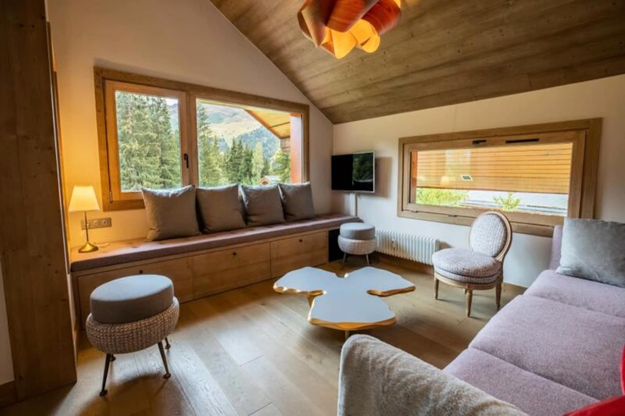 In the heart of Méribel, where alpine tradition meets modern luxury, Chantemerle 19 offers an unforgettable mountain retreat. Positioned on the prestigious Route des Chalets, this exquisite apartment combines contemporary comfort with authentic mountain charm. Imagine stepping out of your residence and directly onto the slopes, embracing the ultimate ski-in/ski-out experience that makes every moment of your holiday seamless and exhilarating.
The apartment’s spacious layout is designed for relaxation and togetherness. A fully equipped kitchen opens into a bright and inviting living/dining area, where a wood-burning stove creates a cozy ambiance after a day on the slopes. The property comfortably accommodates up to ten guests across four bedrooms, including a master suite with an en suite bathroom, a second double bedroom, a bunk room, and a versatile room with two single beds and a mezzanine with additional sleeping space. Modern amenities such as Wi-Fi, a Nespresso machine, a dishwasher, and a washing machine ensure a stress-free stay, while thoughtful touches like a raclette grill and firewood add to the alpine experience.
Chantemerle 19’s location is second to none. Situated between Morel and Rond Point des Pistes, you’ll enjoy easy access to the slopes just 50 meters away, as well as a free shuttle service that connects you to the entire valley. Nearby, you’ll find ski shops, restaurants, and all the essentials for a perfect mountain getaway. Additional services, including ski pass delivery, equipment rental discounts, and private chef options, are available to elevate your stay.
Whether you’re here for the thrill of skiing, the charm of Méribel’s picturesque surroundings, or simply to unwind in a luxurious alpine setting, Chantemerle 19 promises a holiday filled with comfort, convenience, and unforgettable memories.
