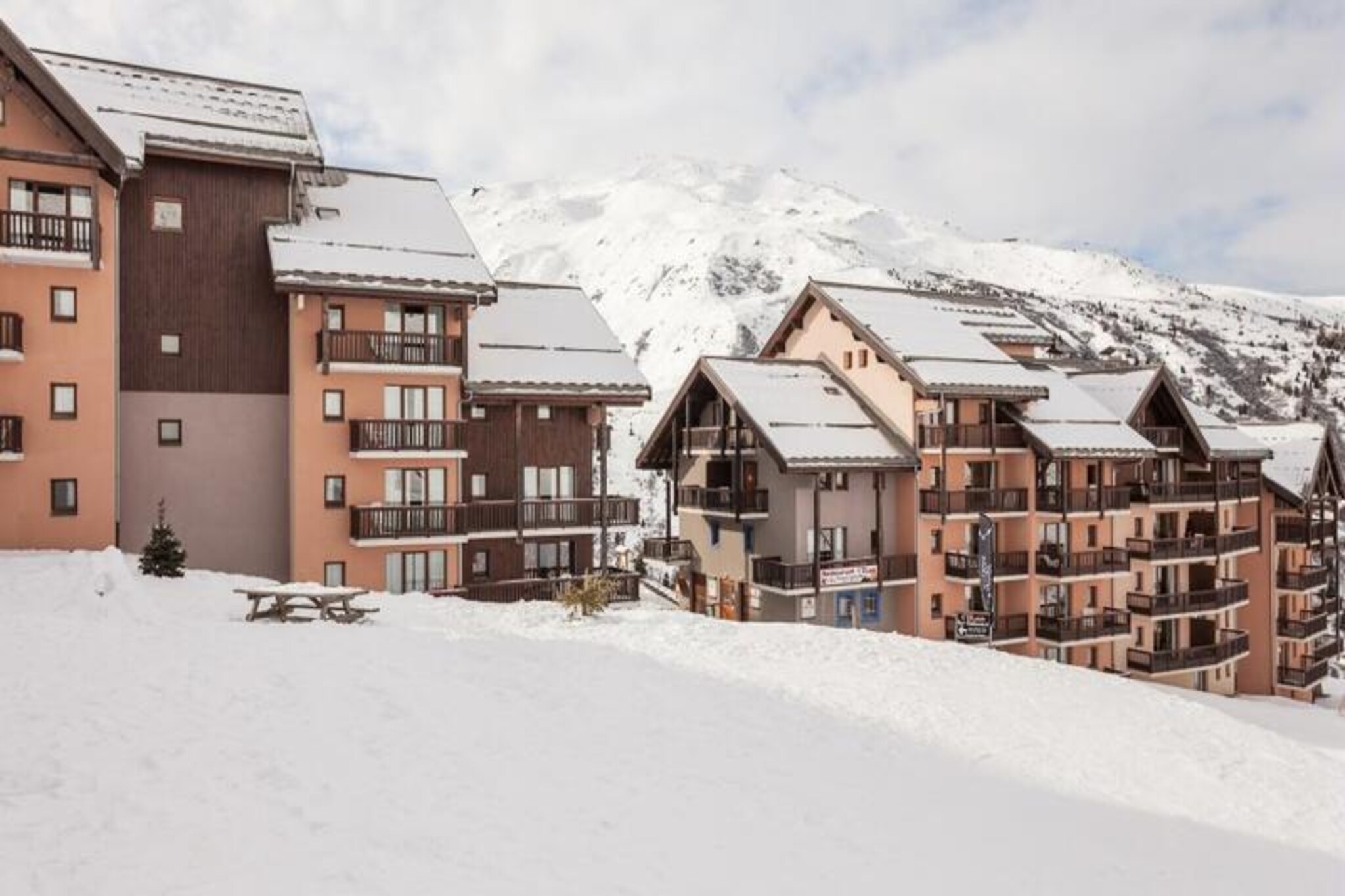 High above the Maurienne Valley, where the Northern and Southern Alps converge, lies the Le Thabor residence in Valmeinier 1800. This charming alpine retreat offers breathtaking views of the snow-dusted Thabor mountains, immersing you in the serene beauty of the French Alps. The residence is perched directly on the slopes, making it a dream destination for ski enthusiasts seeking effortless access to the expansive Galibier-Thabor ski area, which stretches from 1430 to 2600 meters. Whether you're here for a winter wonderland or a summer escape, this location promises unforgettable alpine adventures.
The duplex apartment, located on the 7th floor of the Caribou building, is thoughtfully designed to accommodate up to seven guests. With two cozy bedrooms, two bathrooms, and a spacious living area featuring two sofa beds and a pull-out bed, it’s perfect for families or groups of friends. The open-plan kitchen is equipped for home-cooked meals, while the private balcony offers panoramic views of the surrounding peaks. Modern amenities such as WiFi (available at reception), a flat-screen TV, and pet-friendly options ensure a comfortable and convenient stay.
Valmeinier 1800 is a lively resort offering a warm, welcoming atmosphere. In winter, enjoy direct access to pristine slopes, while summer transforms the area into a haven for hikers and nature lovers. The residence also features a heated outdoor pool (open seasonally), a sauna for post-adventure relaxation, and free covered parking for added convenience. Nearby, you’ll find charming alpine villages, local markets, and countless opportunities to explore the natural beauty of the region.
Whether you're here to carve through fresh powder, hike scenic trails, or simply unwind amidst stunning mountain vistas, Le Thabor residence offers the perfect blend of comfort, adventure, and alpine charm.