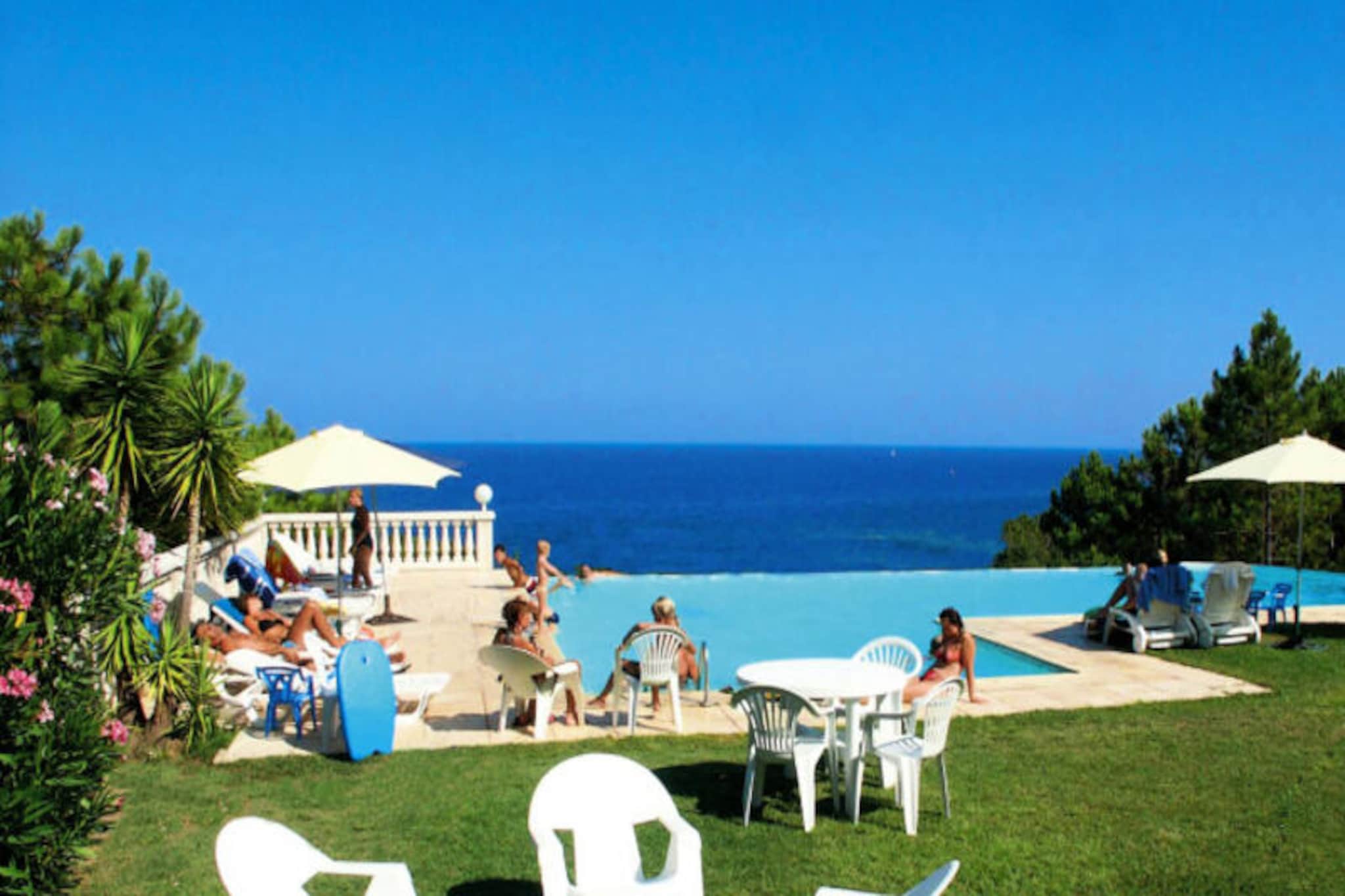 Overlooking the shimmering Mediterranean, the Mare E Monte residence offers a tranquil retreat on a gently sloping hillside, just 200 meters from a secluded cove of sand and rocks. Imagine waking up to the scent of sea air, enjoying your morning coffee on the terrace, and strolling down to the nearby beaches to feel the warm sand between your toes. This serene setting is ideal for families and couples seeking a blend of relaxation and adventure in Corsica’s unspoiled beauty. \n\nThe residence features a cozy living room with a double sofa bed, a well-equipped kitchenette, and two comfortable bedrooms—one with a double bed and another with two singles. Designed to accommodate up to four adults and two children, it provides ample space for everyone to unwind. The panoramic swimming pool, open from mid-May to mid-October, invites you to soak in breathtaking sea views while enjoying a refreshing dip. Additional amenities include WiFi access, TV, and the option to bring your furry friends along for the journey. \n\nBeyond the residence, Corsica’s treasures await. Dive into crystal-clear waters just 1.2 kilometers away or embark on a scenic hike to the Bavella mountain range, only 30 minutes by car. For a taste of local culture, visit the charming fishing village of Solenzara, just 8 kilometers away, or explore Porto Vecchio’s vibrant shops and restaurants, located 30 kilometers from your doorstep. \n\nWhether you’re seeking sun-soaked beaches, mountain adventures, or a peaceful escape, Mare E Monte is your gateway to unforgettable Corsican memories. Book your stay today and experience the island’s magic firsthand.