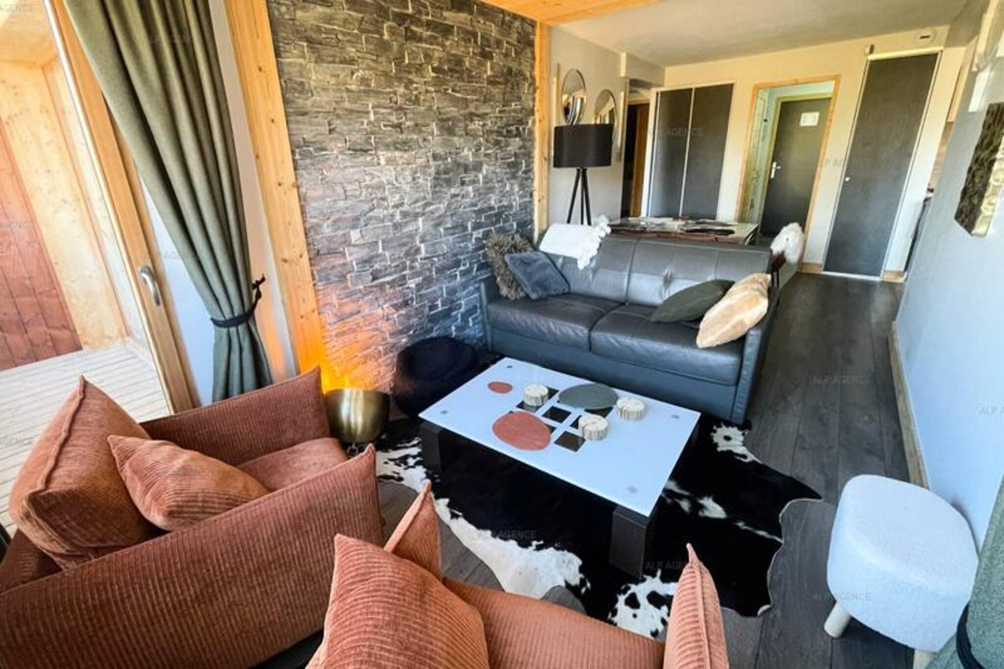 In the heart of Plagne Centre, where the alpine charm of the French Alps meets modern comfort, this exquisite 70m² apartment offers a serene retreat for up to six guests. Imagine waking up to the breathtaking view of Mont Blanc from your private balcony, sipping a warm coffee as the morning sun illuminates the snow-capped peaks. This residence is the perfect blend of tranquility and adventure, located just 200 meters from the ski slopes, making it an ideal choice for winter sports enthusiasts and nature lovers alike.
Step inside to discover a thoughtfully designed space featuring a fully equipped kitchen with modern appliances, including a Nespresso Magimix coffee machine, ceramic hobs, and a dishwasher. The living room invites you to unwind in the cozy lounge area or enjoy meals in the dining space. The apartment boasts two elegant bedrooms: one with a luxurious double bed and en-suite shower room, and another with two single beds that can be joined together. Additionally, a charming cabin bedroom with bunk beds offers a cozy nook for children or extra guests. With two sleek walk-in showers, a separate WC, a washing machine, and a dryer, every detail has been considered to ensure your stay is as comfortable as possible.
Beyond the apartment, Plagne Centre offers a vibrant alpine experience with its proximity to ski lifts, shops, and restaurants. After an exhilarating day on the slopes, store your gear in the private ski locker equipped with a boot dryer and relax knowing your car is safely parked in the covered space. In the summer, the area transforms into a haven for hikers and mountain bikers, with trails that wind through lush meadows and offer panoramic views of the surrounding peaks.
Whether you’re seeking thrilling ski adventures or peaceful alpine escapes, this apartment provides the perfect base for creating unforgettable memories in the heart of the French Alps.