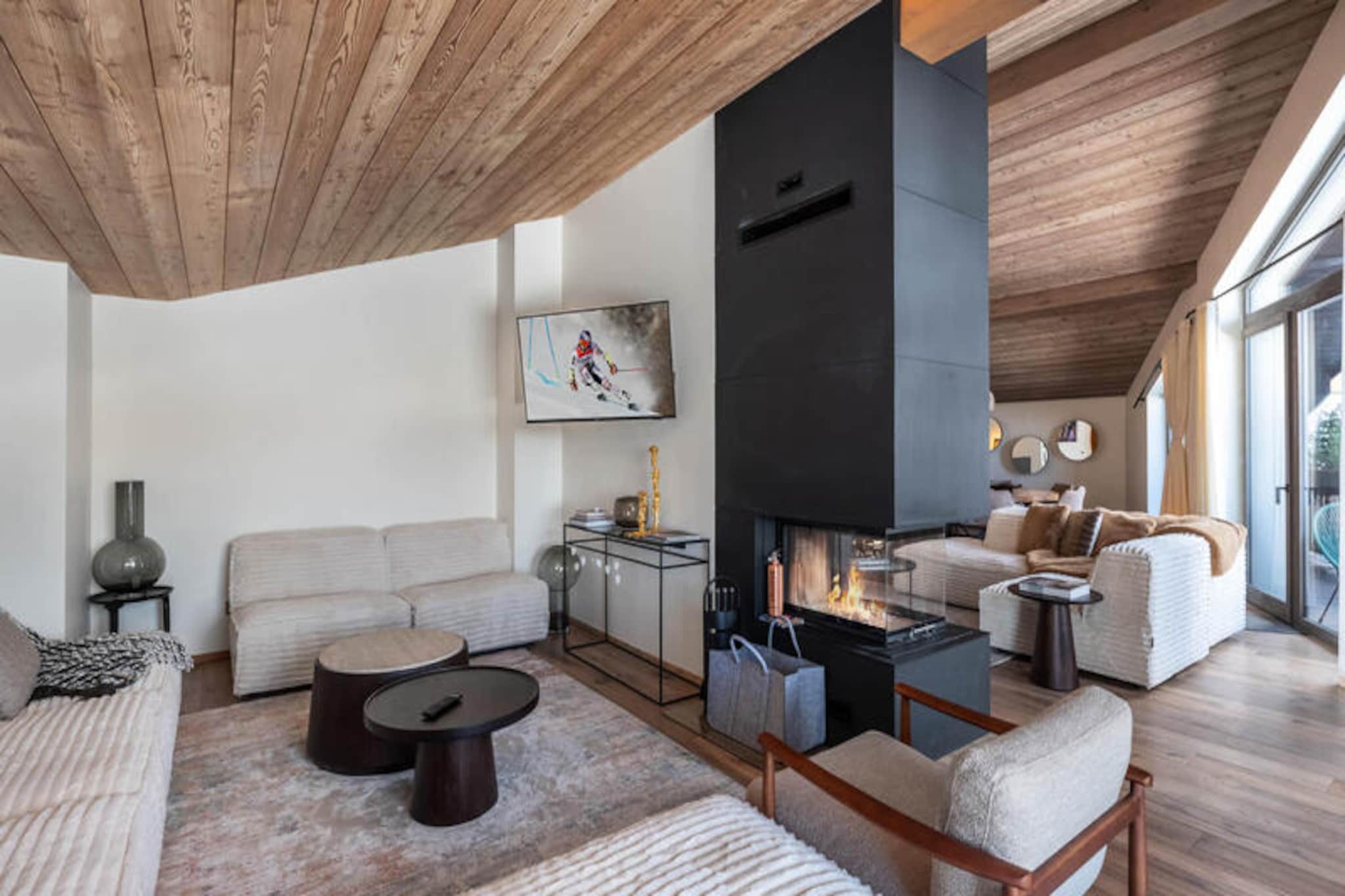 High above the world in the heart of Courchevel 1850, this luxurious duplex apartment offers an unparalleled alpine retreat. Imagine waking up to the crisp mountain air, stepping onto your private balcony, and gazing out at the pristine slopes that lie just beyond your doorstep. With direct ski-in/ski-out access, this residence is a haven for winter sports enthusiasts and those seeking a serene escape amidst the breathtaking French Alps.
Spanning approximately 155m², this elegant property is designed to accommodate up to 6 adults and 2 children. The lower level features three beautifully appointed double bedrooms, each with its own en-suite bathroom and balcony, ensuring both privacy and comfort. The upper level boasts a spacious living area with a cozy fireplace, a dining space, and an open-plan kitchen perfect for sharing meals with loved ones. An additional alcove with two single beds and an en-suite shower room provides a charming retreat for younger guests. Modern amenities such as televisions in every bedroom, a ski room, and covered parking ensure a seamless and comfortable stay.
Beyond the apartment, the residence offers exclusive access to a spa and swimming pool, where you can unwind after a day on the slopes. Located in the vibrant center of Courchevel 1850, you’ll find an array of fine dining, boutique shopping, and après-ski options just moments away. Whether exploring the expansive Three Valleys ski area or indulging in the luxurious amenities, this property places you at the heart of it all.
Perfect for families or groups of friends, this alpine sanctuary combines the thrill of the mountains with the comforts of refined living. Create unforgettable memories in one of the world’s most prestigious ski destinations.
