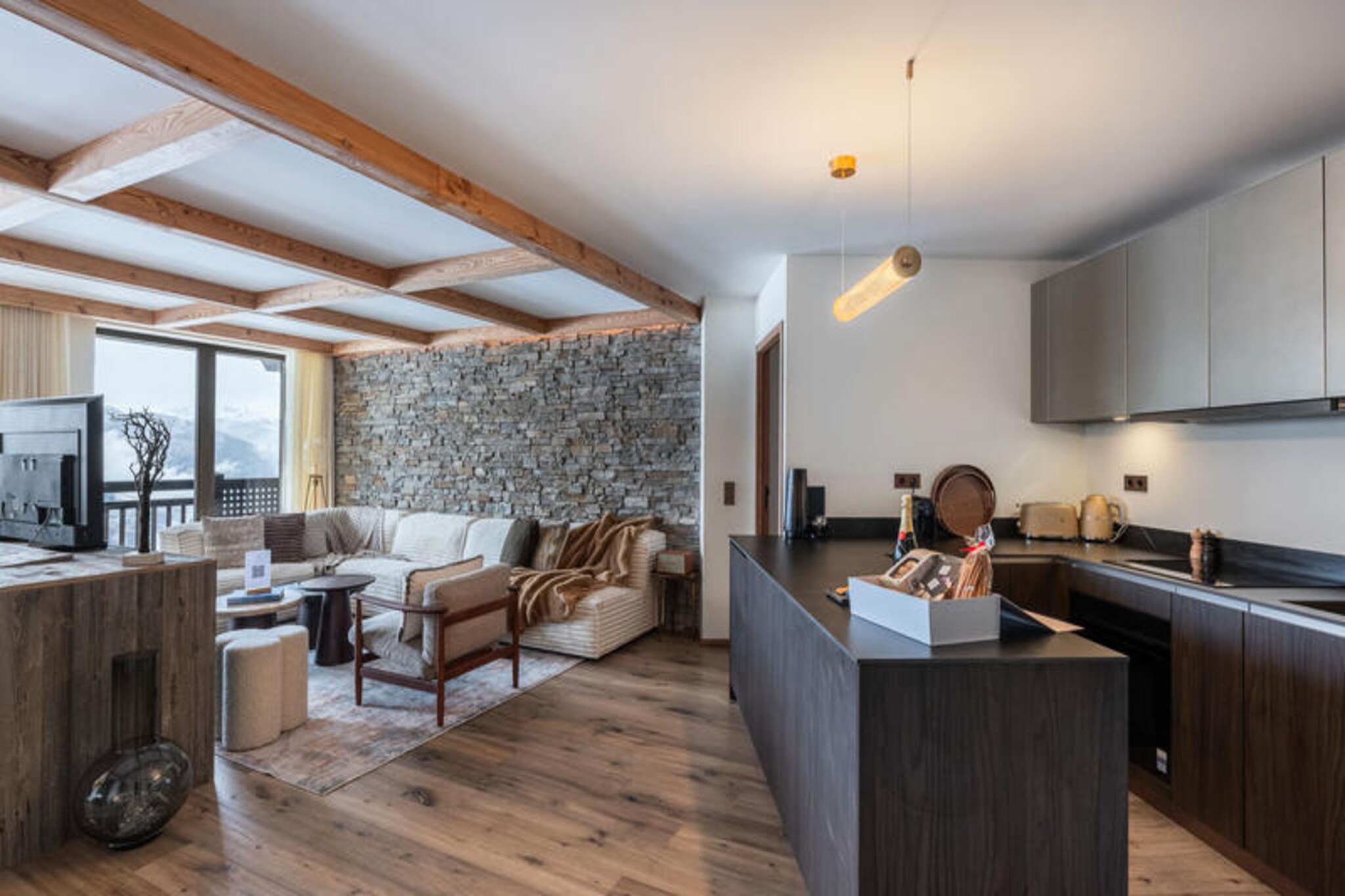 In the heart of Courchevel 1850, where luxury meets alpine charm, this exceptional new residence offers an unparalleled mountain retreat. Imagine waking up to the crisp mountain air, stepping onto your private balcony, and gazing at the snow-dusted peaks that surround you. With the ski slopes literally at your doorstep, accessible from the ski room, this property is a dream for winter sports enthusiasts and those seeking a serene yet vibrant escape.
Spanning an impressive 126m², the apartment comfortably accommodates six adults and two children, making it perfect for families or groups of friends. The interior exudes modern elegance, featuring a spacious living room with a cozy fireplace, a dining area, and an open-plan kitchen equipped with high-end appliances. Each of the three double bedrooms boasts its own en-suite shower room, television, and balcony, offering privacy and comfort. A charming alcove with bunk beds provides a delightful space for children, complete with its own en-suite. Additional amenities include a ski room, covered parking, and access to the residence’s luxurious spa and swimming pool.
Beyond the property, Courchevel 1850 beckons with its world-class dining, exclusive boutiques, and vibrant après-ski scene. Whether you’re gliding down the pristine slopes, indulging in a relaxing spa treatment, or exploring the picturesque village, every moment here is infused with the magic of the French Alps. This residence is more than a place to stay—it’s an invitation to create unforgettable memories in one of the most prestigious ski destinations in the world.