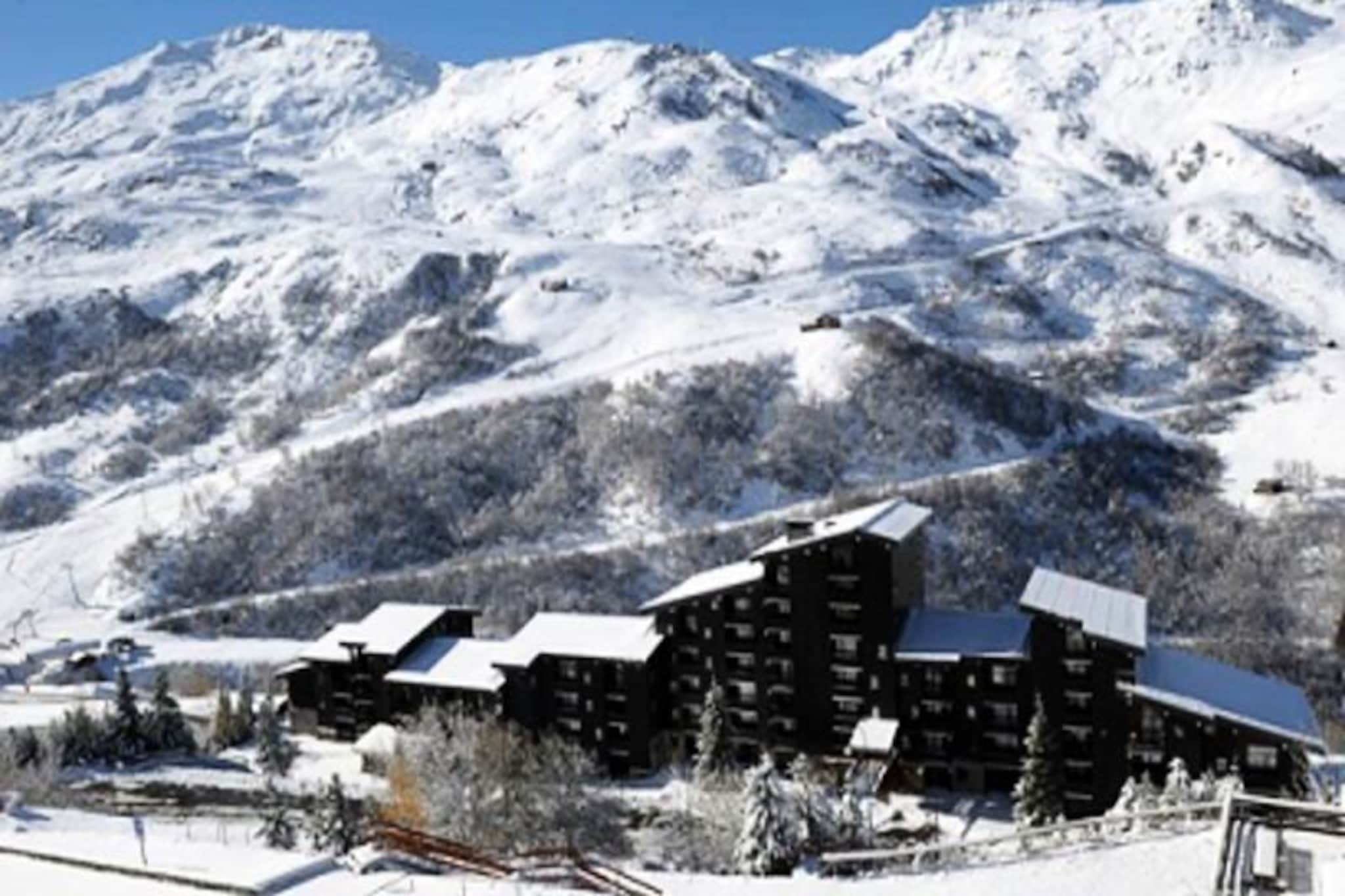 In the serene Fontanettes district of Les Menuires, this charming ground-floor apartment invites you to unwind in a tranquil alpine setting. Just a five-minute walk via public stairs to the lively Croisette district, you’ll enjoy the perfect balance of peace and proximity to the heart of the resort. With free parking conveniently located at the foot of the residence, your arrival and departure are hassle-free, leaving you more time to savor the mountain air and breathtaking scenery. \n\nRecently renovated, this cozy 25 m² apartment is thoughtfully designed to accommodate up to four guests. The living room features a comfortable double sofa bed and a television for relaxing evenings, while the bedroom, separated by a sliding door, offers a unique double mezzanine bed for restful nights. The open-plan kitchen is fully equipped with modern appliances, including a two-burner cooktop, dishwasher, microwave, oven, and a spacious refrigerator, making it easy to prepare hearty meals after a day of adventure. The bathroom includes a refreshing shower, and the separate WC adds convenience to your stay. \n\nLes Menuires is renowned for its world-class skiing and outdoor activities, and the Fontanettes district offers easy access to both. Whether you’re exploring the slopes, hiking scenic trails, or enjoying the vibrant après-ski atmosphere of the Croisette, this apartment serves as an ideal base for your alpine escape. The residence’s peaceful surroundings and mountain charm create a welcoming retreat after a day of excitement. \n\nPerfect for couples or small families, this non-smoking apartment combines comfort, practicality, and a touch of elegance. With its Silver Snowflake rating, it promises a memorable stay in one of France’s most beloved ski destinations. Make this your home away from home and experience the magic of Les Menuires.