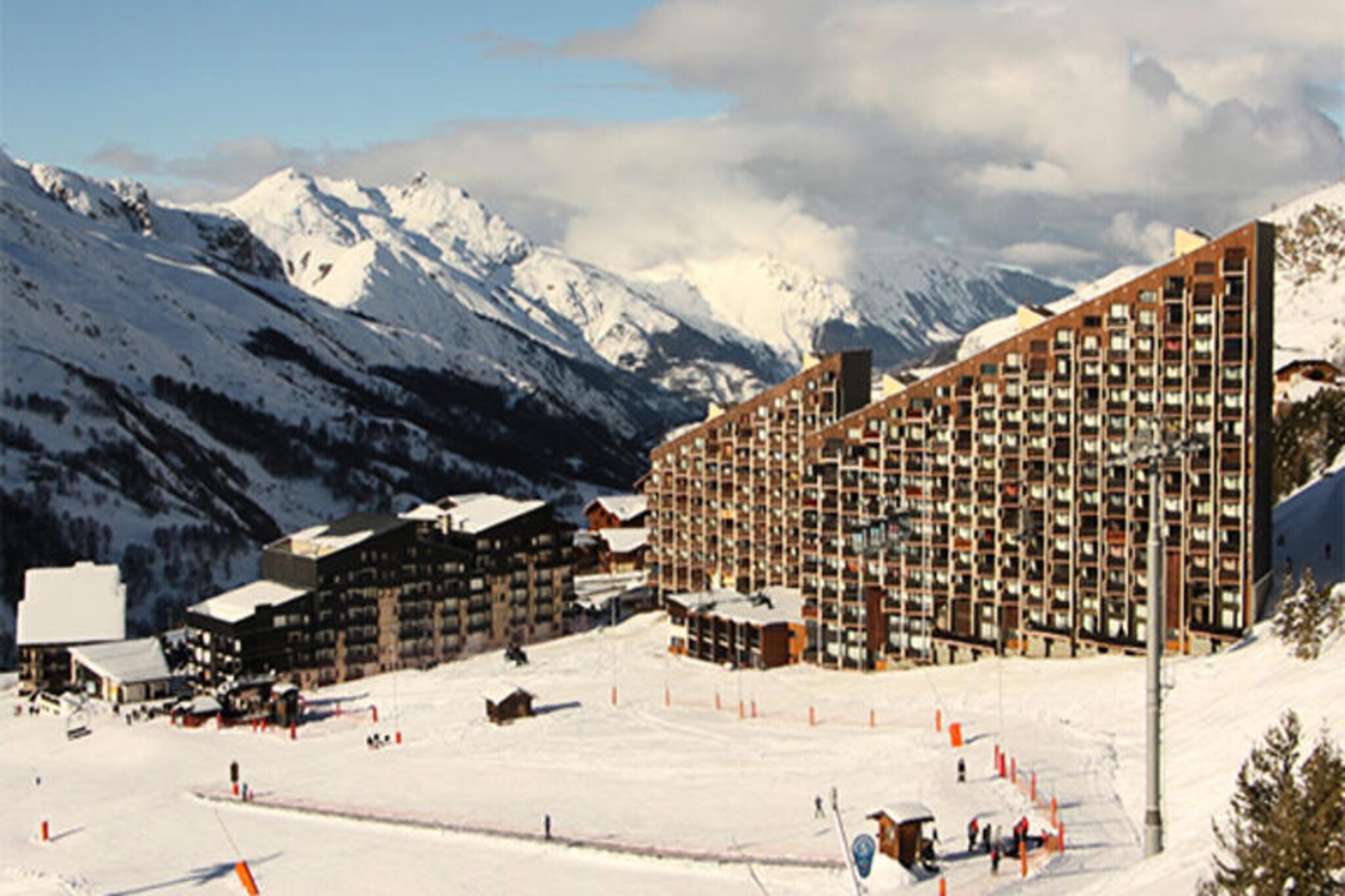 High above the vibrant Preyerand district, this charming studio apartment invites you to experience the magic of the French Alps with direct access to the slopes. From your south-facing balcony, soak in the crisp mountain air and stunning views while planning your day of alpine adventures. The Grande Masse residence offers seamless connectivity to the central La Croisette district via the free TéléPreyerand cable car, operating daily from morning until late evening, ensuring convenience and accessibility throughout your stay. Whether you’re here for skiing, hiking, or simply unwinding, this cozy retreat is your gateway to the beauty of Les Menuires. \n\nDesigned for up to three guests, the 20m² studio features a practical layout with a sofa bed for two in the living area and a separate mountain corner with two single bunk beds. The well-equipped kitchen includes modern amenities such as a microwave/grill oven, dishwasher, refrigerator, and coffee maker, making it easy to prepare hearty meals after a day on the slopes. The bathroom offers a bathtub and towel warmer for added comfort, while the living area provides a television for relaxed evenings indoors. Please note that the upper bunk is not suitable for children under six years old. \n\nStep outside and find yourself at the foot of the slopes, ready to explore the vast ski domain of Les Menuires. The nearby La Croisette district offers a variety of shops, restaurants, and après-ski activities, ensuring that everything you need is within reach. In summer, the region transforms into a haven for hikers and nature enthusiasts with breathtaking trails and panoramic views. \n\nWhether you’re seeking thrilling winter sports or tranquil summer escapes, this studio at Grande Masse promises an unforgettable alpine experience, blending comfort, convenience, and the timeless charm of the French mountains.