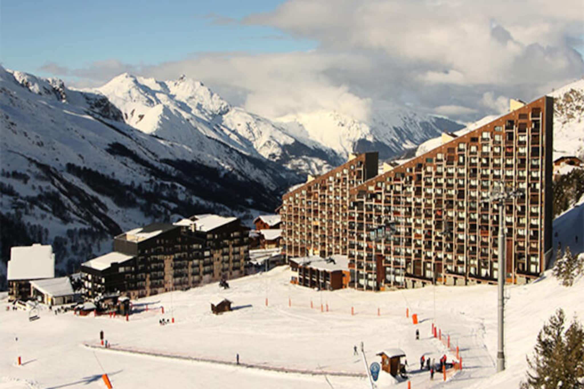 High above the bustling Preyerand district, this charming studio apartment invites you to experience the magic of Les Menuires with slopes right at your doorstep. Imagine waking up to the crisp alpine air and stepping onto your south-facing balcony to soak in the serene mountain views. With the free TéléPreyerand cable car just moments away, connecting you effortlessly to the central La Croisette area, your adventures in the heart of the Three Valleys begin as soon as you step outside. Whether you're here for skiing, snowboarding, or simply to revel in the beauty of the French Alps, this cozy retreat offers the perfect base. \n\nDesigned for up to three guests, the studio features a comfortable living area with a double sofa bed and two single bunk beds, making it ideal for couples or small families. The fully equipped kitchen includes modern appliances such as a refrigerator, microwave, dishwasher, and coffee maker, ensuring you have everything needed to prepare hearty meals after a day on the slopes. The bathroom, complete with a bathtub, provides a relaxing space to unwind, while the television and paid Wi-Fi access keep you connected and entertained. Pets are welcome for a small fee, adding to the homely atmosphere of this non-smoking apartment. \n\nLocated in a prime position, you'll find yourself surrounded by the vibrant energy of Les Menuires. The nearby La Croisette area offers a variety of shops, restaurants, and après-ski activities to enhance your stay. Whether you're exploring the vast Three Valleys ski domain or enjoying the tranquility of the mountain trails, this residence places you at the heart of it all. \n\nChoose this delightful studio for its unbeatable location, cozy ambiance, and easy access to everything Les Menuires has to offer. Perfect for creating unforgettable alpine memories, it’s a place where comfort meets adventure.