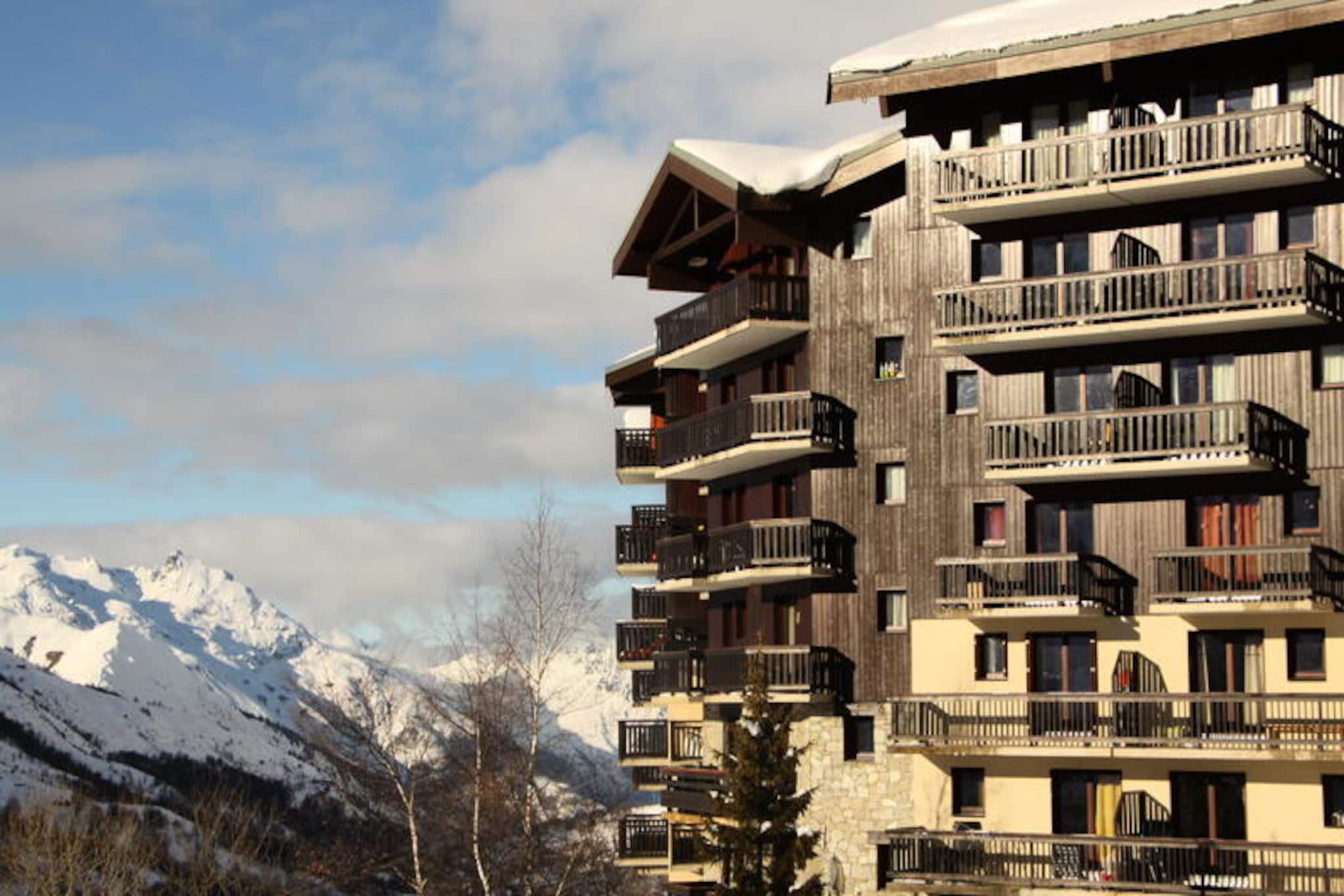 High above the serene slopes of the French Alps, this charming apartment in the Balcons d'Olympie residence offers a cozy retreat for adventurers and nature lovers alike. With breathtaking views from its south-facing balcony, the apartment invites you to soak in the tranquil beauty of the Preyerand district, where alpine charm meets modern convenience. Whether you're here to ski, hike, or simply unwind, the atmosphere promises an unforgettable escape. \n\nInside, the apartment is thoughtfully designed to accommodate up to six guests across its two rooms and sleeping alcove. The living room features a single bed and a pull-out bed, while the bedroom offers two single beds separated by a sliding door for added privacy. The alcove, equipped with a double bunk bed, provides a cozy space for younger guests. A well-equipped kitchen includes a refrigerator, mini-oven, dishwasher, and essential appliances like a kettle and coffee maker, making it easy to prepare meals after a day of adventure. The bathroom features a bathtub for a relaxing soak, and the separate toilet adds convenience. Blankets are provided, and paid Wi-Fi access is available, ensuring a comfortable stay. \n\nThe residence boasts ski-in/ski-out access, making it a dream for winter sports enthusiasts. The free TéléPreyerand gondola lift connects you directly to the central La Croisette area, where you'll find ski lift ticket offices, shops, and restaurants—all less than a 10-minute walk away. In summer, the region transforms into a haven for hikers and mountain bikers, with trails leading to stunning vistas and alpine meadows. \n\nWhether you're seeking thrilling slopes or peaceful mountain moments, this apartment is your gateway to the best of the French Alps. Let the crisp alpine air and majestic surroundings inspire your next adventure.