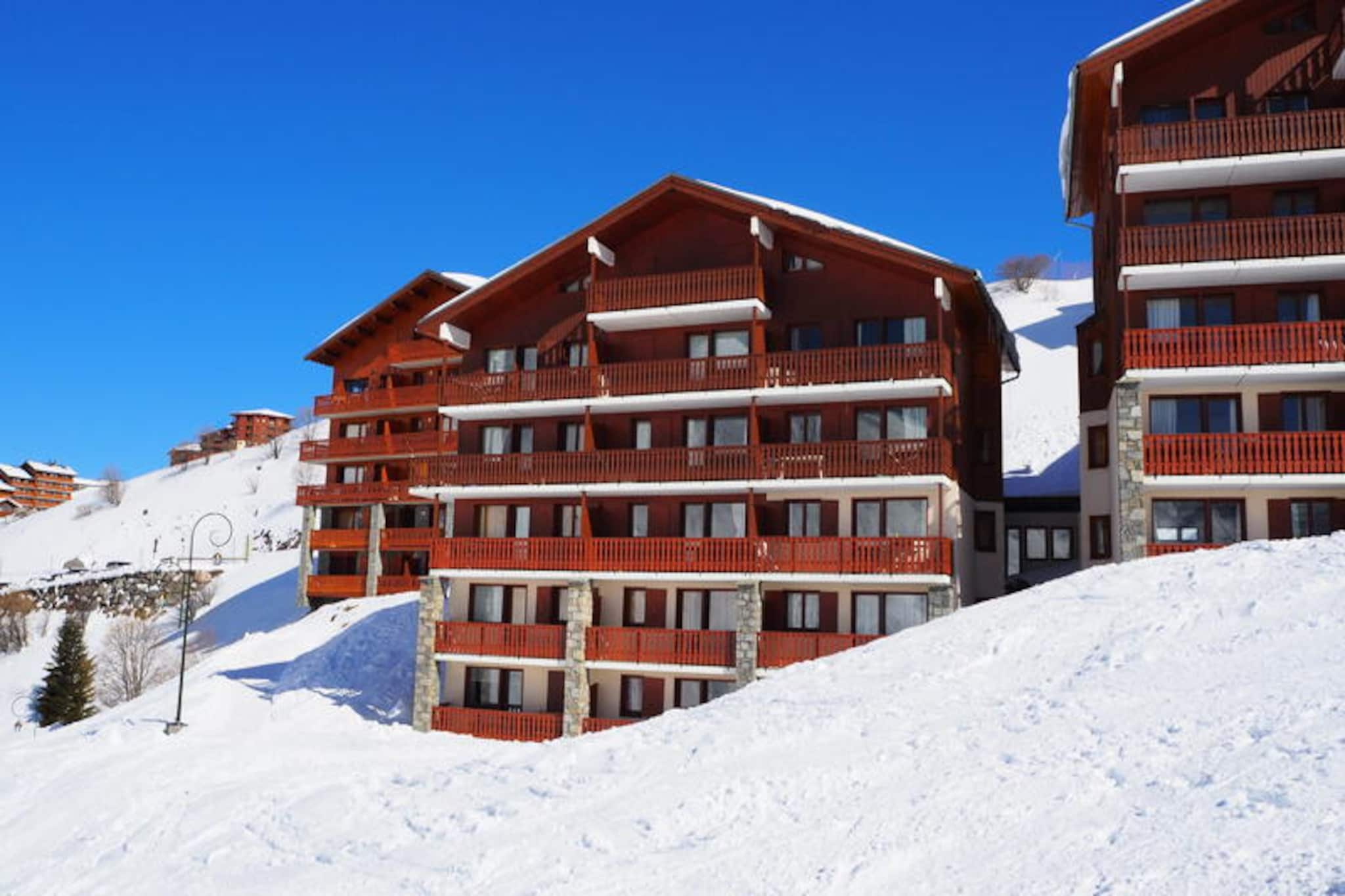 High above the bustling valleys of Les Menuires, this cozy apartment in the Côte d'Or residence offers a serene retreat in the Reberty 1850 district. Imagine waking up to the crisp alpine air and stepping onto your southwest-facing balcony to soak in the sun-drenched mountain views. With ski-in ski-out access right at your doorstep, you’re perfectly positioned to explore the world-class slopes of the Three Valleys ski domain, a paradise for winter sports enthusiasts. Whether you’re here for the thrill of skiing or the tranquility of the mountains, this charming hideaway welcomes you with warmth and comfort. \n\nInside, the apartment’s 36 m² layout is thoughtfully designed to accommodate up to six guests. The living room features a single sofa bed and pull-out bed, complemented by a television and mini stereo system for cozy evenings in. A separate sleeping alcove with bunk beds and a private bedroom with a double bed ensure restful nights for all. The fully equipped kitchen invites you to prepare hearty meals with its ceramic hob, mini-oven, microwave, and even a raclette set for authentic alpine dining. Modern conveniences like free Wi-Fi, a washing machine, and a dishwasher make your stay effortless and enjoyable. \n\nReberty 1850 offers a peaceful ambiance while remaining connected to the vibrant heart of Les Menuires. A pedestrian path leads you to nearby shops and restaurants within 15 minutes, while free shuttle buses provide easy access to La Croisette. The Bruyères district is also within walking distance via a public elevator and bridge, offering even more dining and entertainment options. \n\nWhether you’re seeking adventure on the slopes or a relaxing mountain escape, this apartment combines convenience, charm, and stunning surroundings to create unforgettable memories in the French Alps.