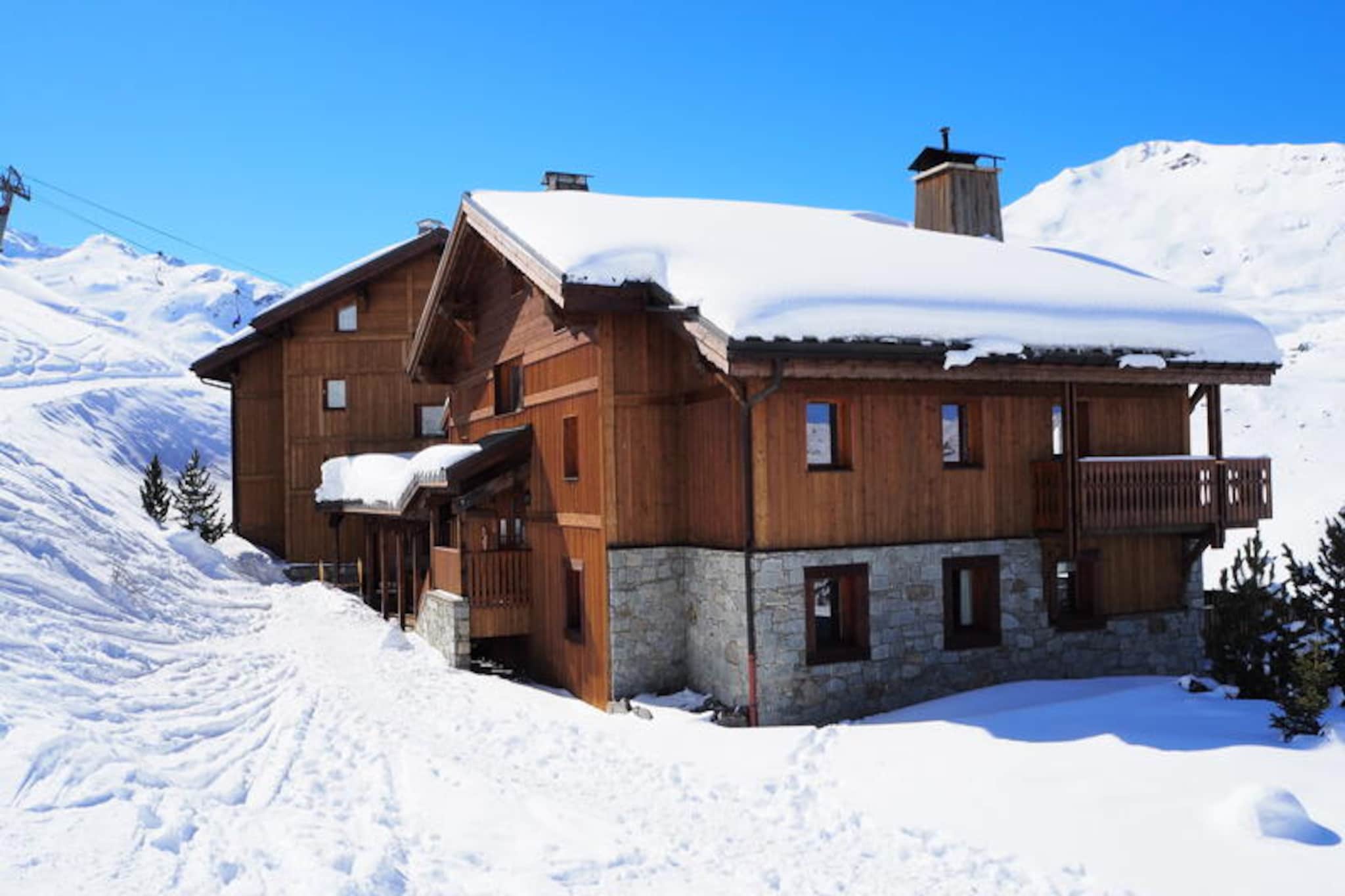 In the serene Sapinière district, this charming alpine apartment offers a tranquil retreat just steps from the slopes and ski lifts. Imagine waking up to the crisp mountain air, sipping your morning coffee on the southwest-facing balcony, and heading straight into a day of snowy adventures. The residence, composed of two large chalets, provides a peaceful atmosphere while still being perfectly positioned for easy access to the vibrant ski scene of the French Alps. \n\nSpanning 60m², this thoughtfully designed 4-room apartment comfortably accommodates up to six guests. The spacious living room invites relaxation with its cozy seating and television, while the fully equipped kitchen ensures effortless meal preparation with modern appliances such as a microwave, oven, refrigerator, and dishwasher. The sleeping arrangements include two double bedrooms and a third room with two single beds, making it ideal for families or groups of friends. Additional amenities include a bathroom with a bathtub, a shower room, and a separate WC, ensuring convenience for all guests. The apartment is non-smoking, pet-free, and features private covered parking for added ease.\n\nBeyond the comfort of the apartment, the Sapinière district offers a prime location for exploring the surrounding alpine beauty. Whether you're hitting the slopes in winter or enjoying scenic hikes in summer, the residence places you at the heart of outdoor adventure. With bed linens and towels provided during winter stays, you'll feel right at home from the moment you arrive. \n\nPerfect for those seeking a balance of relaxation and activity, this alpine escape promises unforgettable memories in the breathtaking French Alps. Whether you're here for the thrill of skiing or the tranquility of mountain vistas, this residence is your gateway to an exceptional holiday experience.