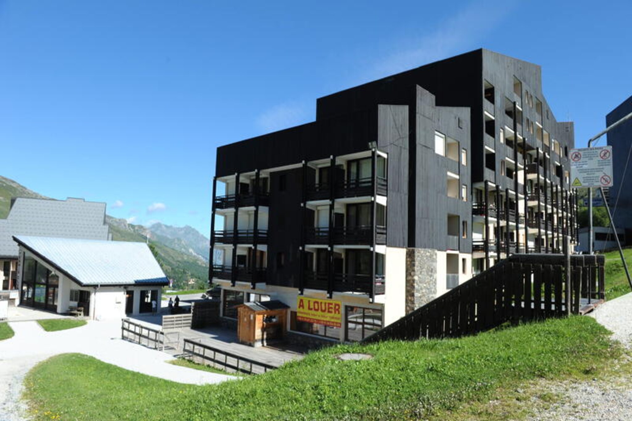 In the heart of the picturesque Preyerand district, this cozy apartment offers a delightful alpine retreat for travelers seeking both convenience and charm. With direct access to the bustling La Croisette area via the free Preyerand cable car, you can immerse yourself in the vibrant atmosphere of Les Menuires in just minutes. Whether you're here for skiing or summer adventures, the location ensures you're always close to the action while enjoying a peaceful haven to unwind after an active day. The south/east-facing balcony invites you to soak in the morning sun and admire the serene mountain views, setting the tone for a perfect holiday. \n\nThis charming 28m² two-room apartment is thoughtfully designed to accommodate up to four guests. The living room features a comfortable single bed and a flat-screen TV, while the open bedroom provides a single bed and a pull-out bed for flexible sleeping arrangements. The alcove with bunk beds is ideal for families or groups, offering a cozy yet functional layout. The fully equipped kitchen includes electric hobs, a mini-oven, refrigerator, kettle, coffee maker, and dishwasher—everything you need to prepare hearty meals after a day on the slopes. The apartment also features a modern bathroom with a shower and separate WC, ensuring comfort throughout your stay. \n\nLocated just a short walk from ski lift ticket offices and essential amenities, you'll find everything you need within easy reach. The free cable car operates daily from 8:00 AM to 11:00 PM, making it effortless to explore the area. In winter, enjoy direct access to world-class ski slopes, while summer transforms the region into a paradise for hiking, biking, and scenic exploration. Les Menuires offers a wealth of activities and entertainment for all ages, ensuring unforgettable memories. \n\nWhether you're seeking thrilling adventures or tranquil moments surrounded by alpine beauty, this apartment is the perfect base for your mountain getaway.