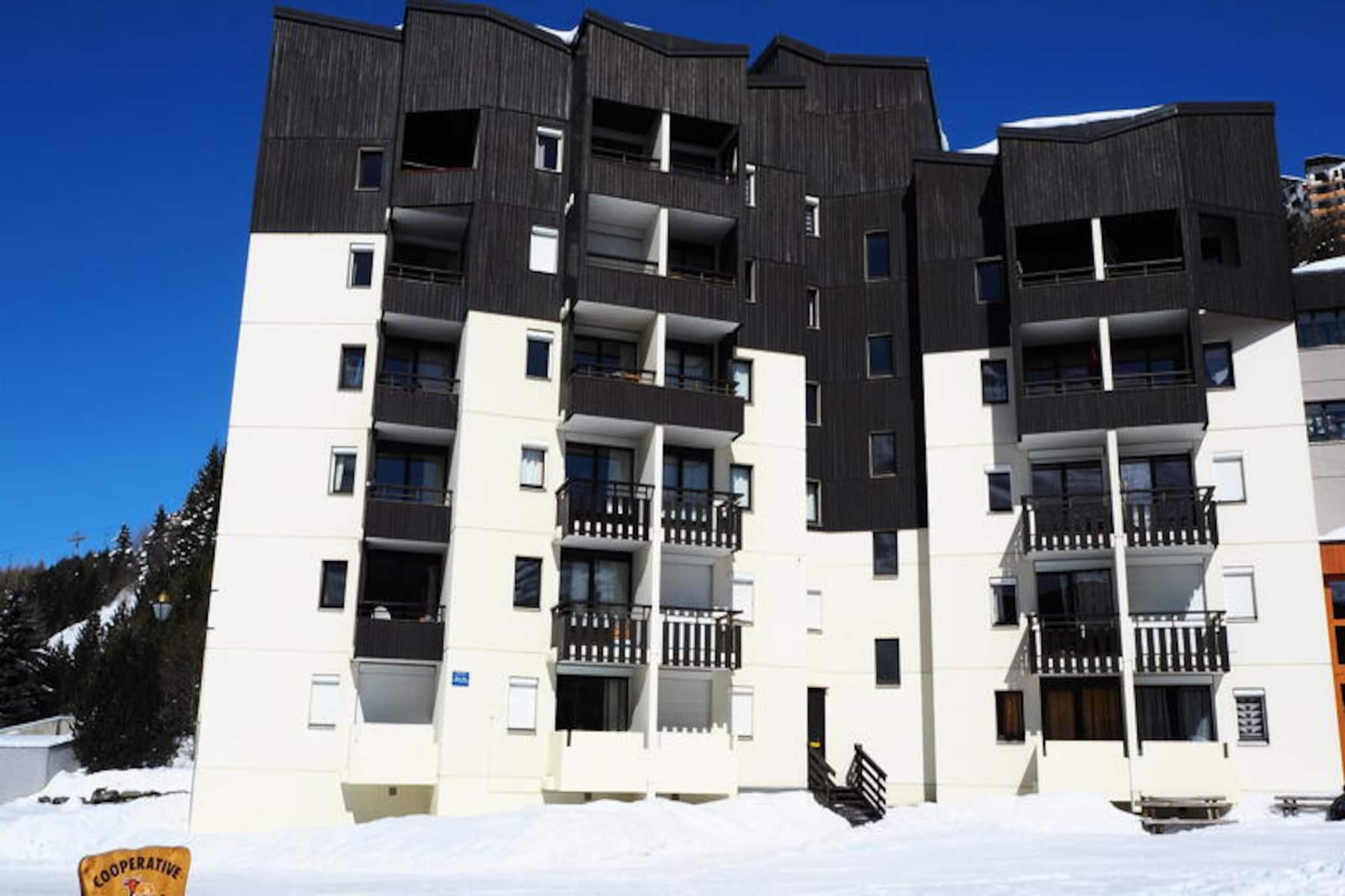 High above the picturesque Belleville Valley, this charming studio apartment offers a cozy alpine retreat for two. Located in the Gentianes residence on Place des Bouquetins, it is perfectly positioned just 20 meters from the slopes, making it an ideal choice for ski enthusiasts seeking effortless access to the pristine runs of Les Menuires. Wake up to the soft glow of the morning sun on your east-facing balcony, and let the crisp mountain air invigorate your senses as you plan your day in this winter wonderland. \n\nThis modern 17 m² studio is thoughtfully designed to maximize comfort and functionality. The living area features a comfortable sofa and a television with a DVD player, perfect for unwinding after an active day on the slopes. The sleeping area boasts a cozy double bed, while the compact kitchen is equipped with a ceramic hob, refrigerator, microwave, coffee maker, and kettle, allowing you to prepare simple meals with ease. The bathroom includes a shower and toilet, and the apartment is fitted with laminate flooring for a clean and contemporary feel. Free Wi-Fi ensures you stay connected, while the residence itself offers convenient amenities such as an elevator, secure entry system, and concierge service. \n\nBeyond the residence, a pedestrian bridge leads to the vibrant Bruyères district, where you’ll find a variety of restaurants, shops, a cinema, and even a water park and wellness center. Families will appreciate the nearby ski school, toboggan run, and children’s playground, while the Croisette district, just a 15-minute walk away, offers additional attractions and services. Whether you’re here for the thrill of skiing or the charm of alpine living, this studio provides the perfect base for your mountain getaway. \n\nWith its unbeatable location, modern amenities, and warm ambiance, this apartment invites you to create unforgettable memories in the heart of the French Alps.