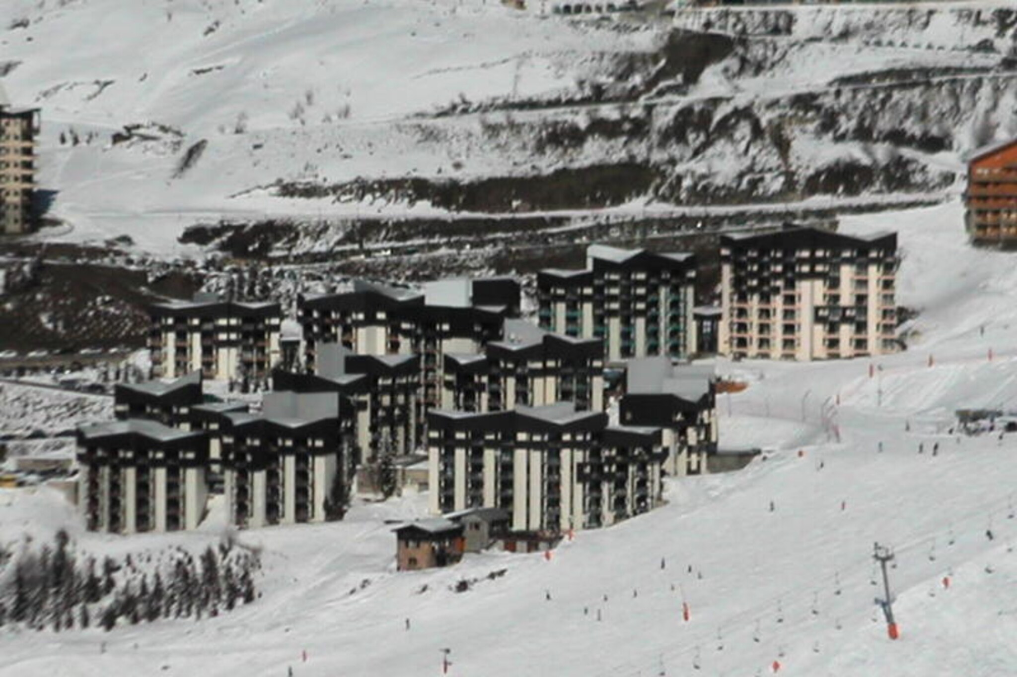High above the picturesque Reberty 1850 district, this charming studio apartment invites you to experience the magic of the French Alps. Wake up to the gentle glow of the morning sun on your east-facing balcony, breathe in the crisp mountain air, and prepare for a day of adventure just 250 meters from the slopes. Whether you're here to carve through fresh powder or enjoy the serene beauty of alpine trails, this cozy retreat offers the perfect base for your holiday escape. \n\nRenovated in 2014, the 18m² apartment combines modern comfort with rustic charm. Designed to accommodate up to three guests, it features a living area with a single bed and pull-out bed, as well as a separate sleeping alcove with an additional single bed. The fully equipped kitchen includes a cooktop, microwave, refrigerator, toaster, kettle, and Senseo coffee machine, making it easy to prepare hearty meals after a day in the mountains. Relax in the living room with a television or unwind in the bathroom with a bathtub. Please note that the apartment is non-smoking, pet-free, and equipped with blankets for added comfort. \n\nThe Médian residence offers free parking at the foot of the building, ensuring convenience for guests arriving by car. Nearby, you'll find shops and a ski school, making it simple to access everything you need for your stay. Paid Wi-Fi is available, subject to coverage, allowing you to stay connected while enjoying your alpine getaway. \n\nWith its prime location, cozy atmosphere, and proximity to the slopes, this studio is an ideal choice for couples or small families seeking a memorable mountain retreat. Let the charm of Reberty 1850 and the breathtaking beauty of the French Alps create unforgettable moments during your stay.