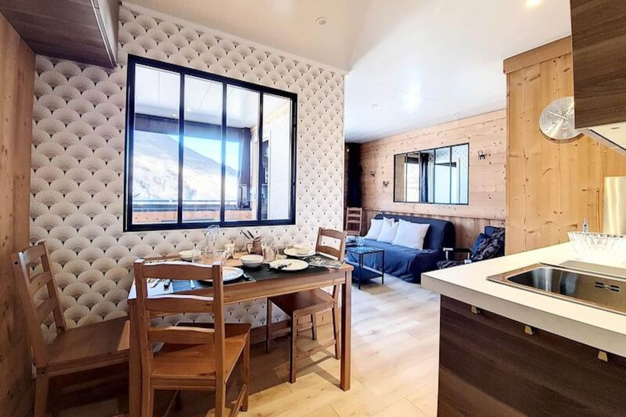In the serene Fontanettes district, where the charm of alpine tranquility meets modern convenience, this beautifully renovated chalet-style apartment invites you to experience the magic of the French Alps. With its west-facing balcony offering breathtaking views of the surrounding mountain range, every moment here feels like a postcard come to life. Whether you're sipping your morning coffee or unwinding after a day on the slopes, the natural beauty of the Alps will be your constant companion. 

This cozy 25m² apartment is thoughtfully designed for up to four guests, blending rustic charm with contemporary comfort. The living room features a comfortable double sofa bed and a flat-screen TV, while the separate bedroom offers a plush double bed with stunning mountain views. The fully equipped kitchen includes modern appliances such as a dishwasher, microwave, and coffee maker, ensuring you have everything you need to prepare hearty meals. A bathroom with a bathtub, separate WC, and laminate flooring throughout add to the convenience and comfort of your stay. Additional amenities like a ski locker with an electric boot dryer and a private outdoor parking space make this apartment a practical choice for your alpine getaway.

The Fontanettes district is a peaceful haven, yet it offers easy access to the vibrant La Croisette and Bruyères districts via free shuttle buses or a scenic 10-15 minute walk along a pedestrian path. Nearby, you'll find a ski rental shop, a bakery, and a restaurant, ensuring all your needs are met within minutes. Whether you're here to carve through the pristine slopes or simply soak in the alpine atmosphere, this location offers the perfect balance of serenity and accessibility.

Choose this charming retreat for your next mountain escape and create unforgettable memories surrounded by the majestic beauty of the French Alps. With its idyllic setting, modern amenities, and warm chalet ambiance, this apartment promises a holiday experience like no other.