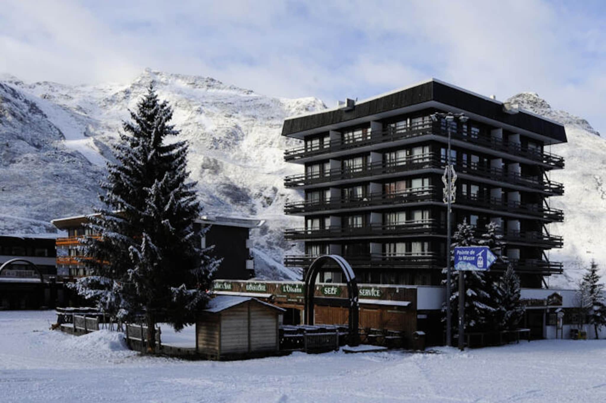 High above the bustling La Croisette district, this charming top-floor apartment invites you to experience the magic of the French Alps. Bathed in sunlight from its spacious south-east facing corner balcony, it offers breathtaking views of the surrounding peaks and slopes. Whether you’re here for winter adventures or summer escapes, the serene atmosphere of this residence promises a memorable stay. Step out of the building and find yourself directly on the shopping arcade, with everything you need just moments away. The slopes are at your doorstep, making it an ideal choice for ski enthusiasts seeking convenience and comfort. \n\nInside, the apartment boasts a cozy yet functional layout, perfect for families or groups of up to six. The living room, equipped with a flat-screen TV, provides a welcoming space to unwind after a day of exploration. The master bedroom features a comfortable double bed, while the second bedroom offers two sets of bunk beds, making it ideal for children or friends traveling together. The separate kitchen is fully equipped with modern appliances, including a refrigerator, oven, microwave, dishwasher, and coffee maker, ensuring you have all the essentials to prepare hearty meals. A shower room and separate WC add to the convenience, while PVC and tiled flooring throughout create a clean and practical environment. \n\nThe residence’s location is unbeatable. Free outdoor parking is available just opposite the building, and the daycare center is a short 300-meter walk away. For those seeking connectivity, paid Wi-Fi access is available, subject to network coverage. Beyond the immediate amenities, the La Croisette district offers a lively atmosphere with shops, restaurants, and après-ski options to enhance your stay. \n\nWhether you’re here to carve through pristine snow or explore alpine trails under the summer sun, this apartment combines comfort, practicality, and an unbeatable location to create the perfect base for your mountain adventures. Let the beauty of the Alps inspire your next unforgettable holiday.