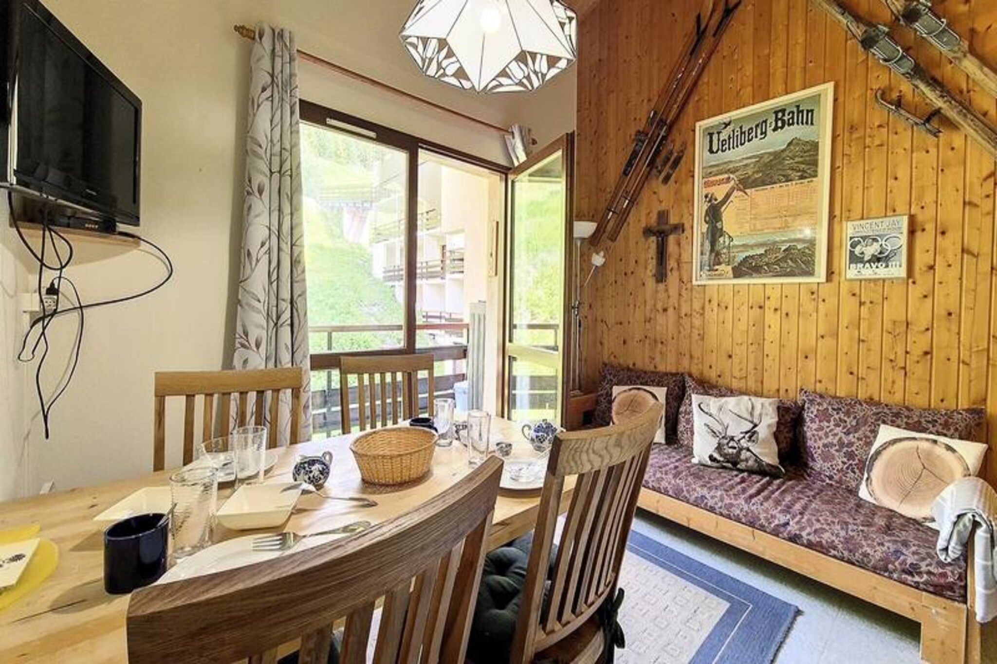 In the serene Fontanettes district of Les Menuires, this charming apartment offers a peaceful retreat amidst the beauty of the French Alps. With its east-facing balcony, guests can wake up to the soft glow of morning sunlight and enjoy breathtaking views of the surrounding peaks. Whether you're here for a winter ski adventure or a summer escape, the tranquil atmosphere of this area provides the perfect backdrop for relaxation and exploration. Conveniently connected to the bustling La Croisette and Bruyères districts by free shuttle buses or a scenic 10-15 minute walk, you'll have easy access to the heart of the resort while enjoying the quiet charm of Fontanettes. 
                      This cozy 33.50 m² apartment is thoughtfully designed to accommodate up to four guests. Located on the 4th floor with elevator access, it features a mezzanine sleeping area with two single bunk beds and a separate bedroom with a comfortable double bed. The living room, equipped with a television, invites you to unwind after a day of alpine adventures. The fully equipped kitchen includes modern amenities such as a refrigerator, oven, microwave, mini dishwasher, and even a raclette grill for a true taste of local cuisine. A ski locker at the entrance ensures your gear is secure and ready for the slopes. 
                      Nearby, you'll find a ski rental shop, a bakery, and a restaurant, making it easy to prepare for your day or enjoy a leisurely meal. The apartment also includes free Wi-Fi and a dedicated parking space for added convenience. Whether you're exploring the vast ski slopes or hiking the scenic trails, this residence offers a blend of comfort and accessibility. 
                      Escape to Les Menuires and create unforgettable memories in this delightful alpine haven, where the majestic beauty of the mountains meets the warmth of a cozy retreat.