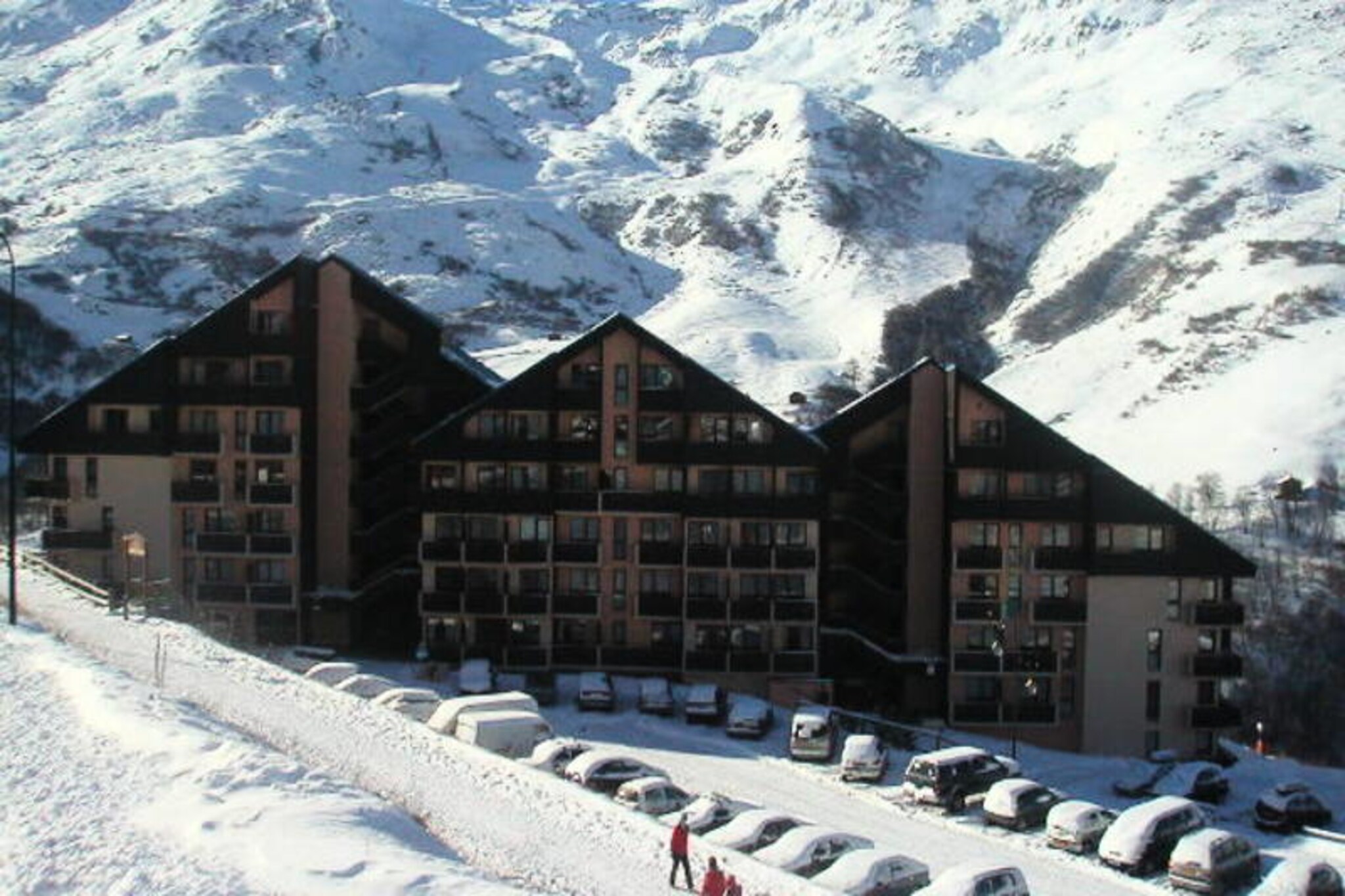 High above the serene Preyerand district, this charming studio apartment invites you to experience the magic of Les Menuires with slopes right at your doorstep. Imagine waking up to the crisp mountain air and stepping out onto your southeast-facing balcony, where the sun casts a golden glow over the snowy peaks. Whether you’re here for thrilling ski adventures or tranquil alpine escapes, this cozy retreat is your gateway to the wonders of the French Alps. With the free Preyerand cable car connecting you directly to the bustling La Croisette district, convenience is just minutes away. Operating daily from 8:00 AM to 11:00 PM, it ensures effortless access to amenities, ski lift ticket offices, and après-ski delights.   Inside, the 24.50 m² studio is thoughtfully designed to accommodate up to four guests. The living area features a comfortable sofa bed for two, complemented by a television and DVD player for cozy evenings in. A separate sleeping alcove offers bunk beds and ample storage, making it ideal for families or close-knit groups. The kitchen is fully equipped with modern appliances, including a multi-function oven, dishwasher, and coffee maker, ensuring you can prepare hearty meals after a day on the slopes. The bathroom comes with a shower, and there’s a separate WC for added convenience.   Les Menuires is more than just a ski destination; it’s a vibrant alpine village with activities and attractions for every season. From exhilarating descents to peaceful hikes, this studio places you at the heart of it all. With blankets provided, paid Wi-Fi access, and a no-pet policy, every detail has been considered for a comfortable stay. Whether you’re seeking adventure or relaxation, this mountain retreat promises unforgettable memories in the enchanting French Alps.