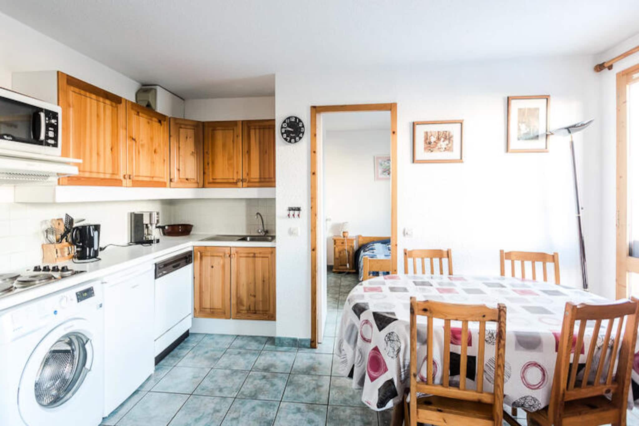 Set amidst the charming alpine village of Montchavin Les Coches in La Plagne, this delightful apartment offers a cozy retreat for ski enthusiasts and nature lovers alike. Just a minute’s walk from the slopes and local shops, the residence Le Tetras Lyre combines convenience with a tranquil mountain setting, perfect for creating unforgettable holiday memories. From your west-facing balcony on the second floor, soak in the serene views as the sun sets over the snowy peaks, inviting you to relax and unwind after a day of adventure. \n\nDesigned to accommodate up to four guests, this thoughtfully arranged 36m² apartment features a comfortable open-plan kitchen and living area equipped with modern amenities such as a dishwasher, refrigerator, microwave, and even a Krups coffee maker for your morning brew. The living room includes a pull-out sofa bed and a flat-screen TV, while the bedroom boasts a double bed and en-suite shower room for added privacy. A sleeping alcove with bunk beds provides a cozy space for children or friends, ensuring everyone feels at home. Practical touches like a separate WC, ski lockers, and boot storage make your stay hassle-free, while free outdoor parking just 200 meters away adds to the convenience. \n\nMontchavin Les Coches is a gateway to the renowned Paradiski domain, offering endless skiing and snowboarding opportunities in winter and scenic hiking trails in summer. Explore the nearby shops, indulge in local Savoyard specialties, or venture further to discover the breathtaking landscapes of the Tarentaise Valley. Whether you’re here to carve through pristine slopes or bask in the alpine charm, this apartment is your perfect base for an unforgettable mountain getaway.