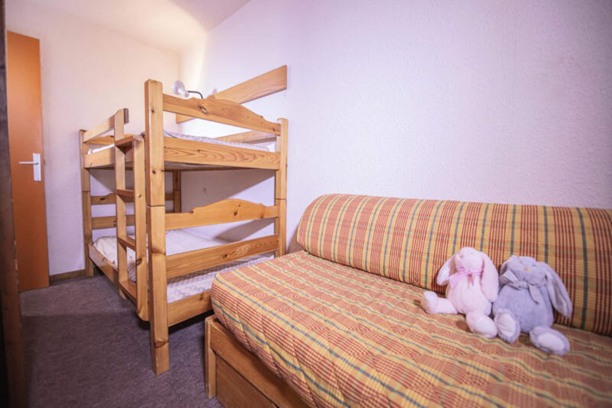 High above the picturesque Embrun valley, this elegant studio apartment in Les Orres 1650 invites you to a holiday filled with mountain charm and modern comfort. Imagine waking up to the golden hues of the Hautes-Alpes sunshine streaming through your southwest-facing balcony, offering uninterrupted panoramic views of the surrounding peaks. Whether you're sipping coffee or enjoying a quiet moment with a book, this serene setting is the perfect retreat after a day of alpine adventures. \n\nThe 30m² studio is thoughtfully designed to accommodate up to four guests, featuring a cozy sleeping alcove and a comfortable living area. The fully equipped kitchen, complete with a dishwasher, microwave/grill, and all essential utensils, makes it easy to prepare meals and share laughter over dinner. Sleeping arrangements include a pull-out sofa bed, a bunk bed, and a single sofa bed, ensuring flexibility and comfort for families or small groups. After an active day, unwind in the bathroom's inviting bathtub, perfect for soaking away the day's adventures.\n\nPositioned just steps from the snow front and chairlifts, the residence ensures seamless access to the slopes, while its 19-meter-high walkway adds a touch of architectural flair. Beyond skiing, the resort offers a vibrant array of activities, from mountain biking and zip-lining to treetop adventure courses. Shops, restaurants, and bakeries are all within 100 meters, making it easy to explore the local flavors and culture.\n\nWith a private ski locker for your equipment and the warmth of a cozy fireplace or a game of billiards awaiting you in the residence, this apartment is more than a place to stay—it's a gateway to unforgettable alpine memories. Whether you're here for the thrill of the slopes or the tranquility of the mountains, Les Orres 1650 promises a holiday like no other.