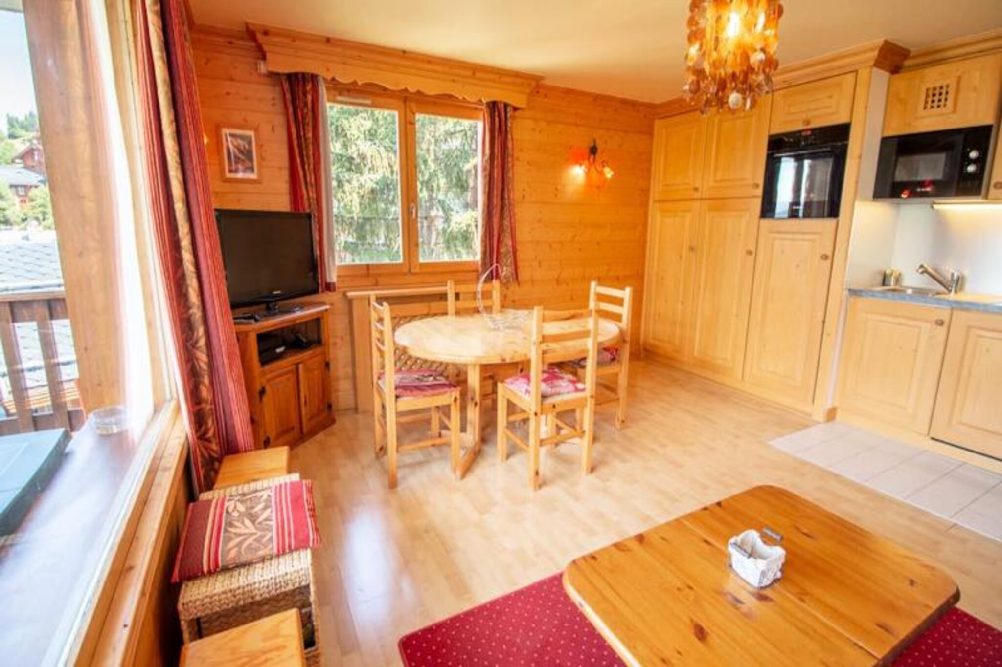 With the majestic Tougnete slope in full view and the Morel chairlift just 50 meters away, this charming apartment in Méribel invites you to experience the ultimate alpine escape. Imagine sipping your morning coffee on the spacious west-facing balcony, soaking in the golden hues of the setting sun after a day on the slopes. Whether you're here for the thrill of skiing or simply to unwind amidst breathtaking mountain scenery, this property offers a perfect blend of comfort and convenience. 
 
 Step inside to discover a warm and inviting living space, thoughtfully designed to cater to your every need. The large living room is perfect for cozy evenings, while the fully equipped kitchen, complete with a refrigerator, dishwasher, microwave, and oven, makes meal preparation a breeze. The apartment comfortably accommodates up to four guests, featuring a serene bedroom with a double bed and a sleeping alcove with bunk beds. A bathroom with a bathtub and a separate toilet add to the convenience, ensuring a relaxing stay. 
 
 The location is unbeatable for ski enthusiasts. The Morel area not only provides quick access to the slopes but also places you within a short walk of Méribel's vibrant center. Nearby, you'll find a small Sherpa supermarket, cozy restaurants like Alti 16 and Aux Petits Oignons, and a ski shop for all your equipment needs. The free shuttle service makes exploring the valley effortless, running every 15 minutes during peak times. 
 
 Whether you're carving through fresh powder, indulging in local Savoyard cuisine, or simply enjoying the serene mountain atmosphere, this apartment offers the perfect base for an unforgettable holiday in the heart of the 3 Valleys.