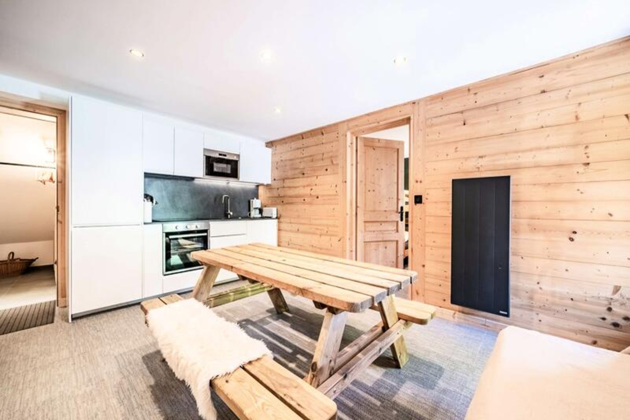 In the heart of the charming alpine village of Morzine, this beautifully renovated ground-floor apartment offers a serene retreat for up to six guests. Just 100 meters from the tourist office and a short 400-meter stroll to the ski school, it’s perfectly situated for both winter sports enthusiasts and summer adventurers. The surrounding peaks and lush landscapes create an idyllic backdrop for your stay, whether you're here to carve through fresh powder or explore the vibrant trails of the Portes du Soleil region.
Step inside and discover a thoughtfully designed space that blends modern comfort with alpine charm. The living room features an open-plan kitchen, a cozy lounge area with a television, and direct access to a private terrace where you can soak in the crisp mountain air. The apartment boasts two comfortable bedrooms: one with a double bed and two single bunk beds, complete with an en-suite shower room and WC, and another with a double bed and its own en-suite facilities. With WiFi, a dedicated parking space, and included amenities like bed linen, towels, and end-of-stay cleaning, every detail has been considered to ensure a hassle-free holiday.
Morzine’s central location offers easy access to an array of activities and attractions. In winter, the nearby ski lifts open up the vast Portes du Soleil ski area, while summer brings opportunities for hiking, mountain biking, and enjoying the region’s Summer Multipass program. The village itself is brimming with charming shops, restaurants, and après-ski spots, making it a lively yet relaxing destination year-round.
Whether you’re seeking thrilling outdoor adventures or a peaceful alpine escape, this apartment provides the perfect base for unforgettable memories in the French Alps.