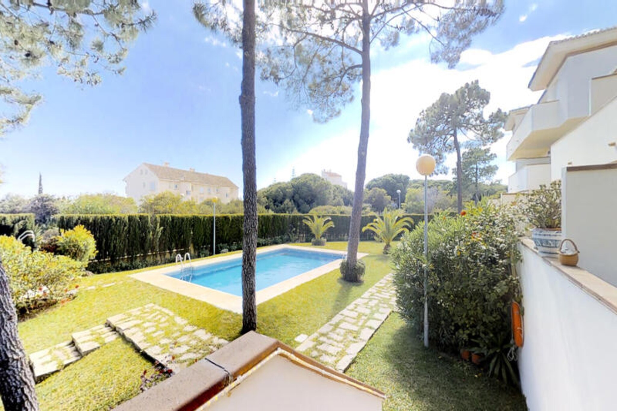 Imagine waking up to the gentle sound of waves and the warm embrace of the Mediterranean sun in this beautifully renovated family apartment in Marbesa, Elviria, Marbella. Perfectly situated just 400 meters from some of the most stunning beaches in the area, this ground-floor retreat offers a seamless blend of comfort, luxury, and convenience for your next holiday escape. Surrounded by charming restaurants, beach clubs, and lush gardens, it’s a haven for relaxation and entertainment. \n\nStep inside and discover a thoughtfully designed space featuring three spacious bedrooms and two modern bathrooms, accommodating up to six guests. The fully equipped kitchen, complete with top-of-the-line appliances, invites you to create culinary delights, while the adjoining laundry room ensures practicality throughout your stay. The centerpiece of the apartment is the expansive living room, where floor-to-ceiling French doors open onto a private terrace. This outdoor space is perfect for al fresco dining, with a barbecue and cozy seating area, and provides direct access to the pool and garden. \n\nGolf enthusiasts will appreciate the nearby course, while families will love the convenience of the supermarket and the ability to watch their children play in the communal pool from the terrace. Additional amenities include Wi-Fi, air conditioning, satellite TV, and a workspace with essential peripherals for those combining leisure with work. \n\nWhether you’re seeking a peaceful retreat or an active holiday, this apartment offers the perfect setting to create unforgettable memories. Relax under the Andalusian sun, explore the vibrant Marbella area, and enjoy the best of coastal living in this exquisite property.