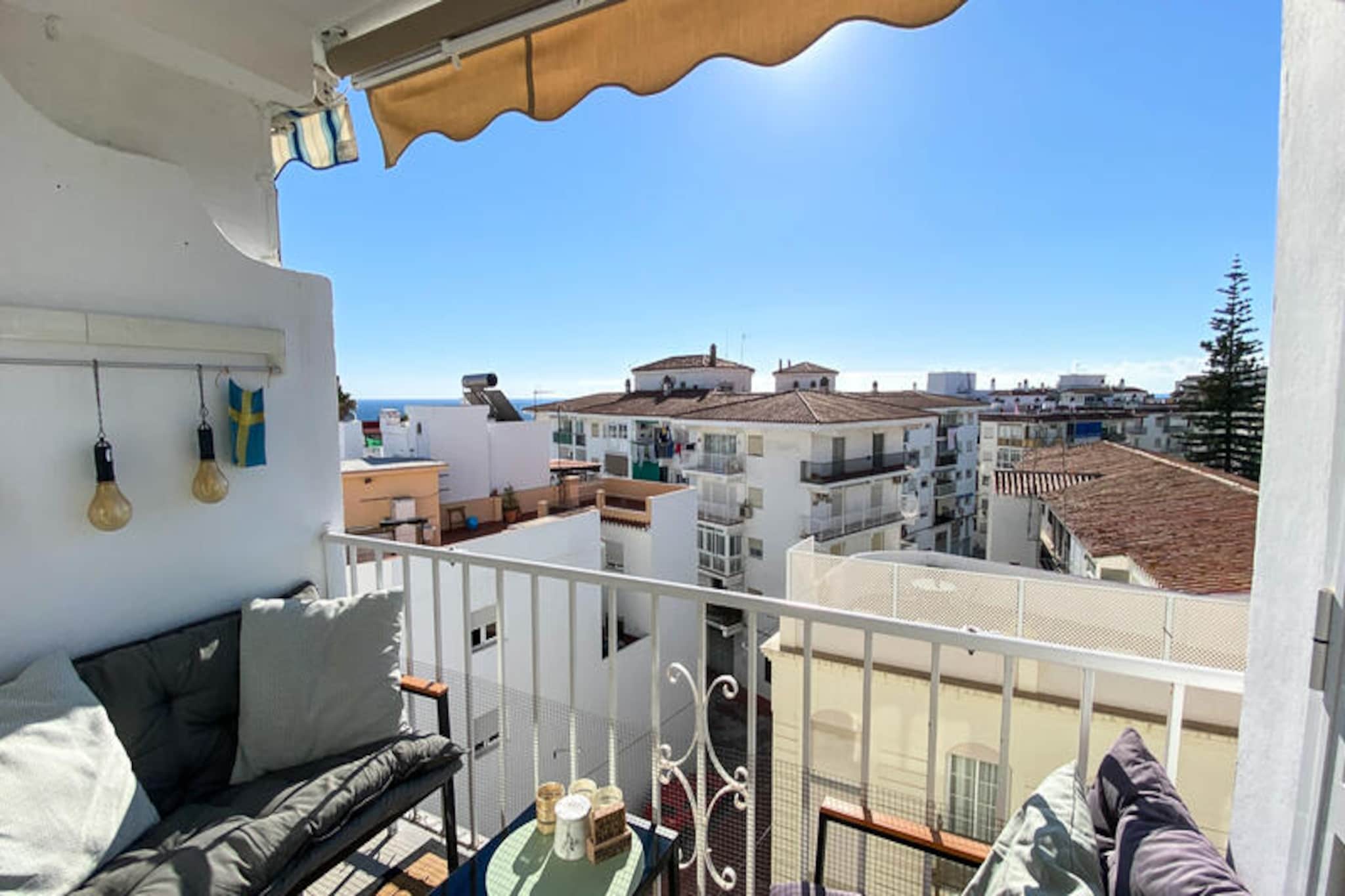 In the heart of Nerja’s vibrant streets, this charming apartment offers a perfect blend of modern comfort and Mediterranean charm. Imagine stepping out onto your private terrace to enjoy the gentle Andalusian breeze, surrounded by the lively atmosphere of this coastal gem. Whether you're here to explore the town's historic streets or relax on its golden beaches, this property promises an unforgettable stay. 
 
 The apartment comfortably accommodates up to four guests across two tastefully designed bedrooms. The 65 m² space is thoughtfully furnished with a modern touch, ensuring a cozy and stylish retreat. The open-plan American-style kitchen is fully equipped with everything you need, from a refrigerator and microwave to a dishwasher and coffee maker, making it easy to prepare your favorite meals. Additional amenities include air conditioning, heating, a washing machine, and satellite TV with multiple language options, ensuring your stay is as convenient as it is comfortable. 
 
 Just 450 meters away, you’ll find Playa El Salón, a stunning sandy beach perfect for sunbathing and swimming. The nearby Playa Torrecilla offers a more rugged coastal experience. For those who love nature, the breathtaking Maro-Cerro Gordo Cliffs Natural Park is only 12 km away, while the scenic Río Chillar invites you to explore its tranquil trails just 3 km from the property. Local restaurants, cafes, and shops are all within walking distance, immersing you in the vibrant culture and flavors of Nerja. 
 
 Whether you’re seeking a romantic getaway, a family retreat, or a base to explore the wonders of Andalusia, this apartment is your gateway to a memorable Mediterranean escape.
