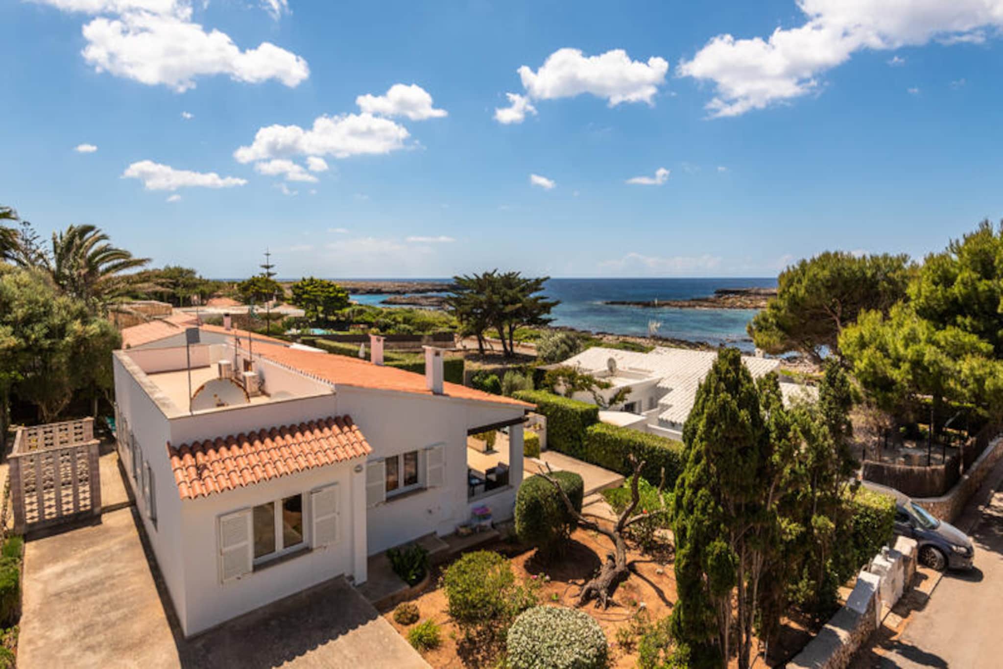 On the serene southern coast of Menorca, in the charming neighborhood of Binisafuller, Villa Binillor offers a tranquil retreat just minutes from the turquoise waters of Cala Binisafuller. Here, the gentle sea breeze and Mediterranean sun create the perfect backdrop for a relaxing holiday. The villa is surrounded by the authentic charm of Sant Lluís, where quaint bars and restaurants serve delicious local cuisine with stunning sea views. This is a place where time slows down, letting you savor every moment of your getaway. \n\nVilla Binillor boasts a spacious outdoor area designed for unforgettable moments. Dive into the private pool, bask in the sun on the terrace, or gather around the barbecue for evenings filled with laughter and delicious meals. The covered terrace provides a shaded haven for dining or simply unwinding with a book and a glass of wine. Inside, the villa is equally inviting, with a large living room featuring satellite TV and Wi-Fi to keep you connected. The fully equipped kitchen is perfect for preparing meals with fresh local ingredients, while the four double bedrooms offer a peaceful retreat after a day of exploring. \n\nThe villa’s location is ideal for discovering the beauty of Menorca. Cala Binisafuller, just a short walk away, invites you to swim in crystal-clear waters or relax on its sandy shore. Nearby, the picturesque village of Sant Lluís offers a taste of Menorca’s rich history and culture. Whether you’re exploring hidden coves, indulging in seafood delicacies, or simply soaking up the island’s natural beauty, Villa Binillor is your gateway to an unforgettable Mediterranean escape.
