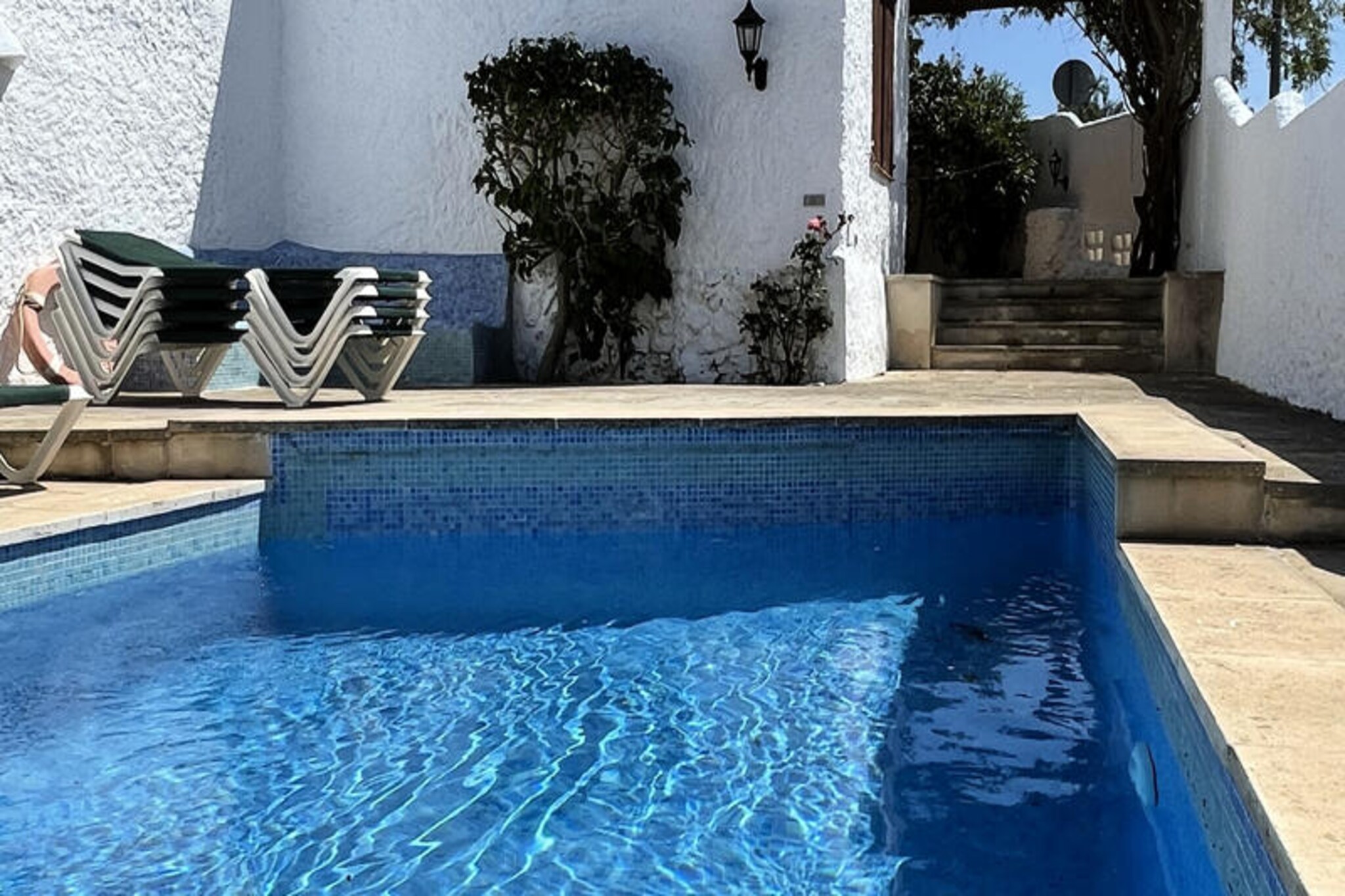 On the sun-drenched southern coast of Menorca, Villa FIFI invites you to experience the charm of Cala'n Porter, a vibrant seaside town just a short stroll from shops, bars, and restaurants. This delightful villa is the perfect retreat for families seeking a relaxing holiday in one of Menorca’s most sought-after locations, where everything you need is within easy reach, eliminating the need for constant car travel. Here, the Mediterranean lifestyle unfolds effortlessly, blending tranquility with convenience.
Designed in traditional Menorcan style, this single-story villa accommodates up to six guests in three comfortable double bedrooms. The interior boasts a cozy living room equipped with Wi-Fi and satellite TV, ensuring entertainment for all. The fully equipped kitchen provides everything you need to prepare delicious meals, while two bathrooms offer convenience and privacy for your group. The villa’s layout is thoughtfully designed to create a welcoming and functional space for families or friends.
Step outside and immerse yourself in the serene outdoor area. Whether you’re lounging with a book, soaking up the sun, or enjoying a refreshing dip in the private pool, the villa’s exterior is a haven of relaxation. A charming brick barbecue and a dining table set the stage for memorable family dinners under the stars, making every evening a celebration of togetherness.
With its unbeatable location and peaceful ambiance, Villa FIFI is your gateway to exploring Menorca’s natural beauty and vibrant culture. From the golden sands of Cala'n Porter beach to the nearby attractions, this villa promises an unforgettable Mediterranean escape.